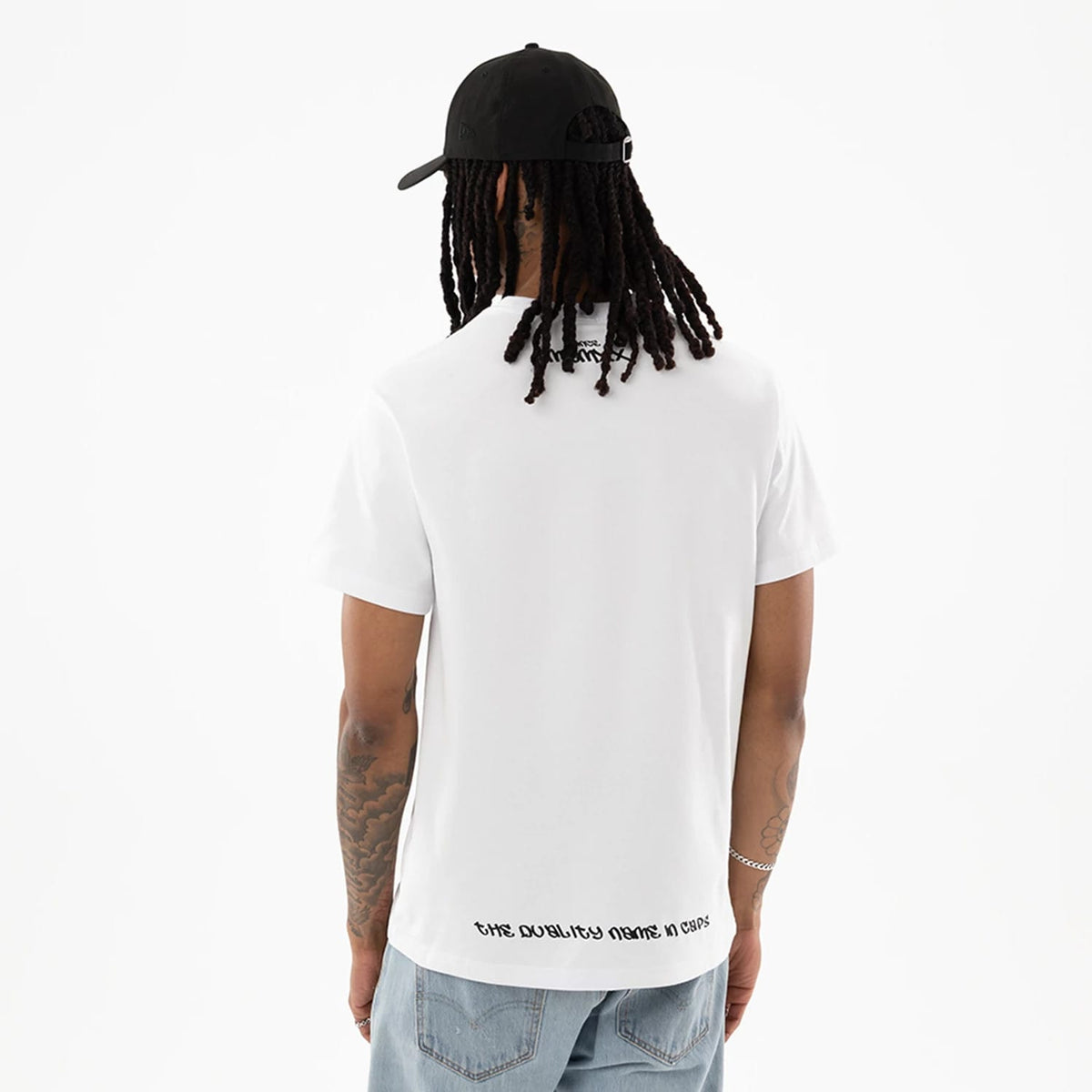 The model is wearing this New Era I Am Original T-Shirt in white. 2