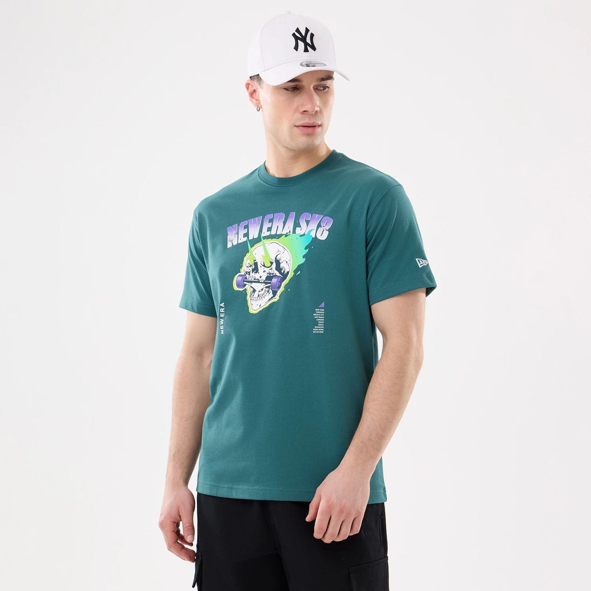 The model is wearing this New Era SK8 Graphic T-Shirt in dark green. 1