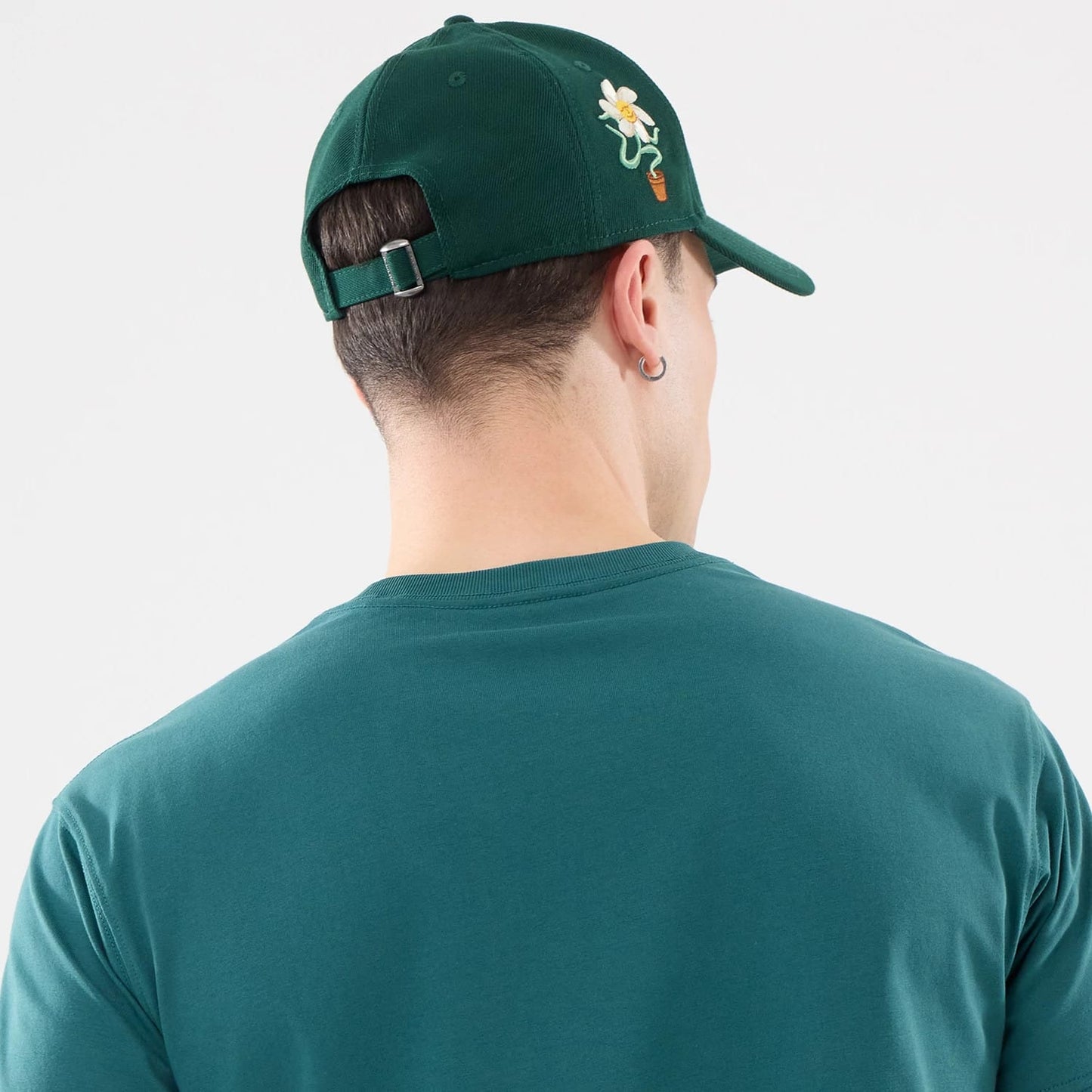 The model is wearing this New Era Earth Day T-Shirt in dark green. 7
