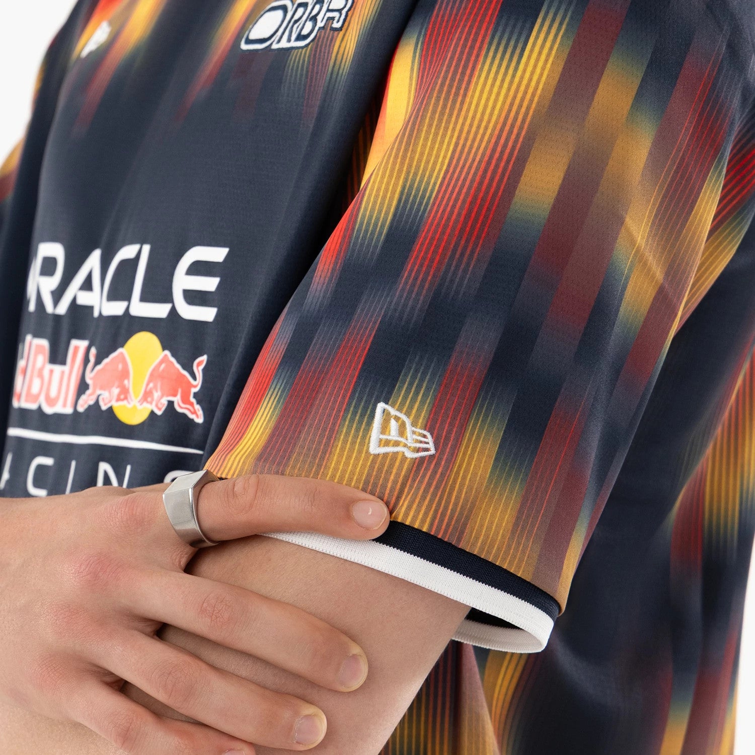 The model is wearing this Red Bull Racing Soccer Jersey in multi. 4