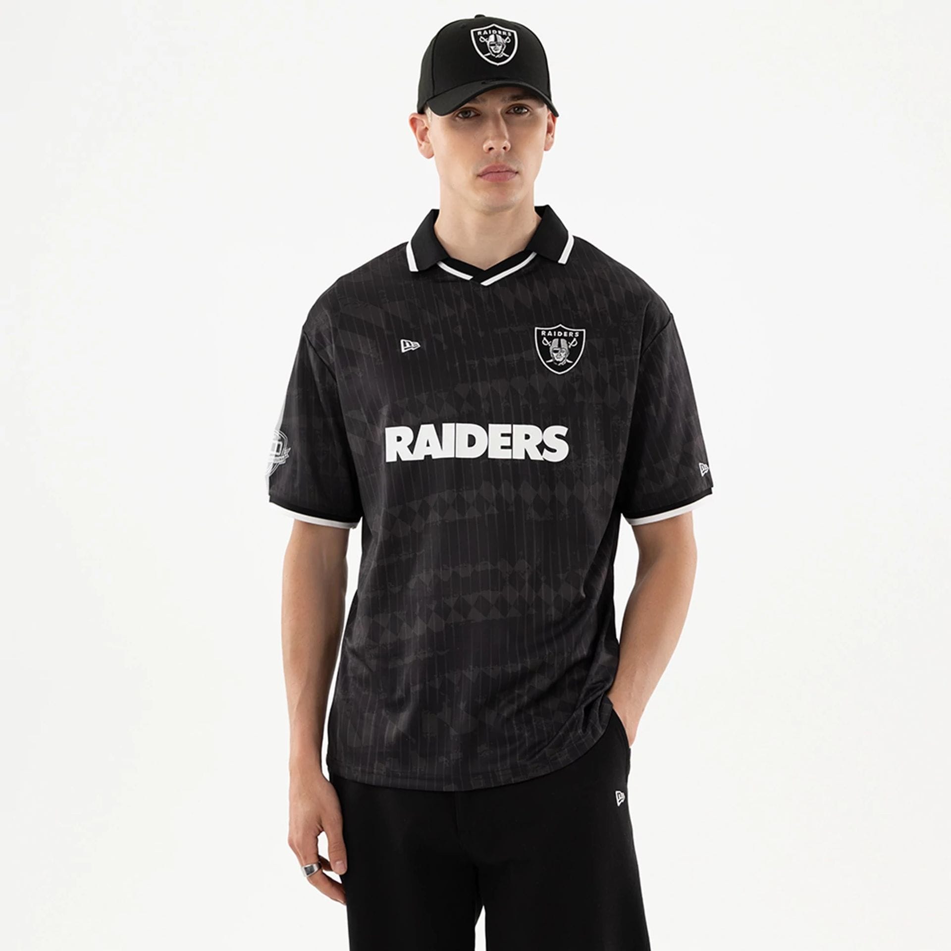 The model is wearing this NFL Las Vegas Raiders Soccer Jersey in black. 1