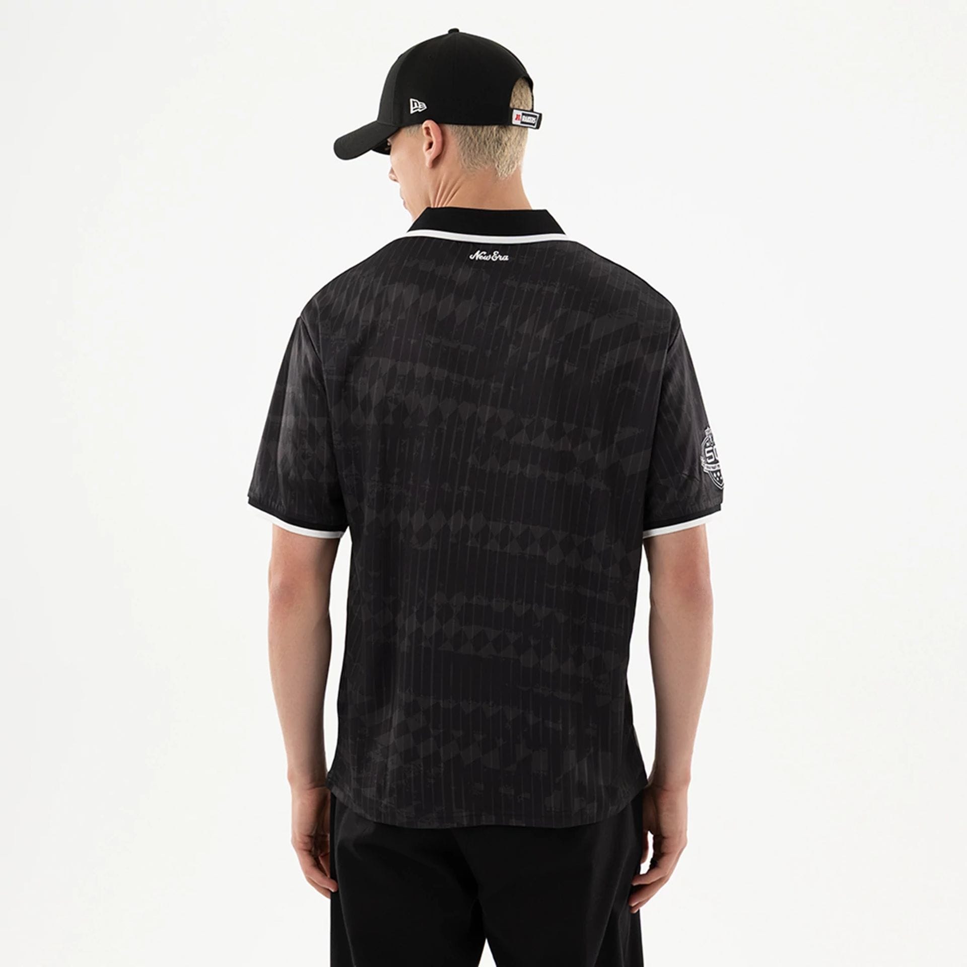 The model is wearing this NFL Las Vegas Raiders Soccer Jersey in black. 2