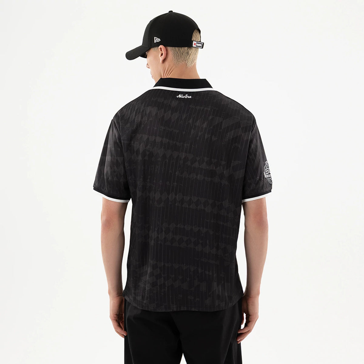 The model is wearing this NFL Las Vegas Raiders Soccer Jersey in black. 2