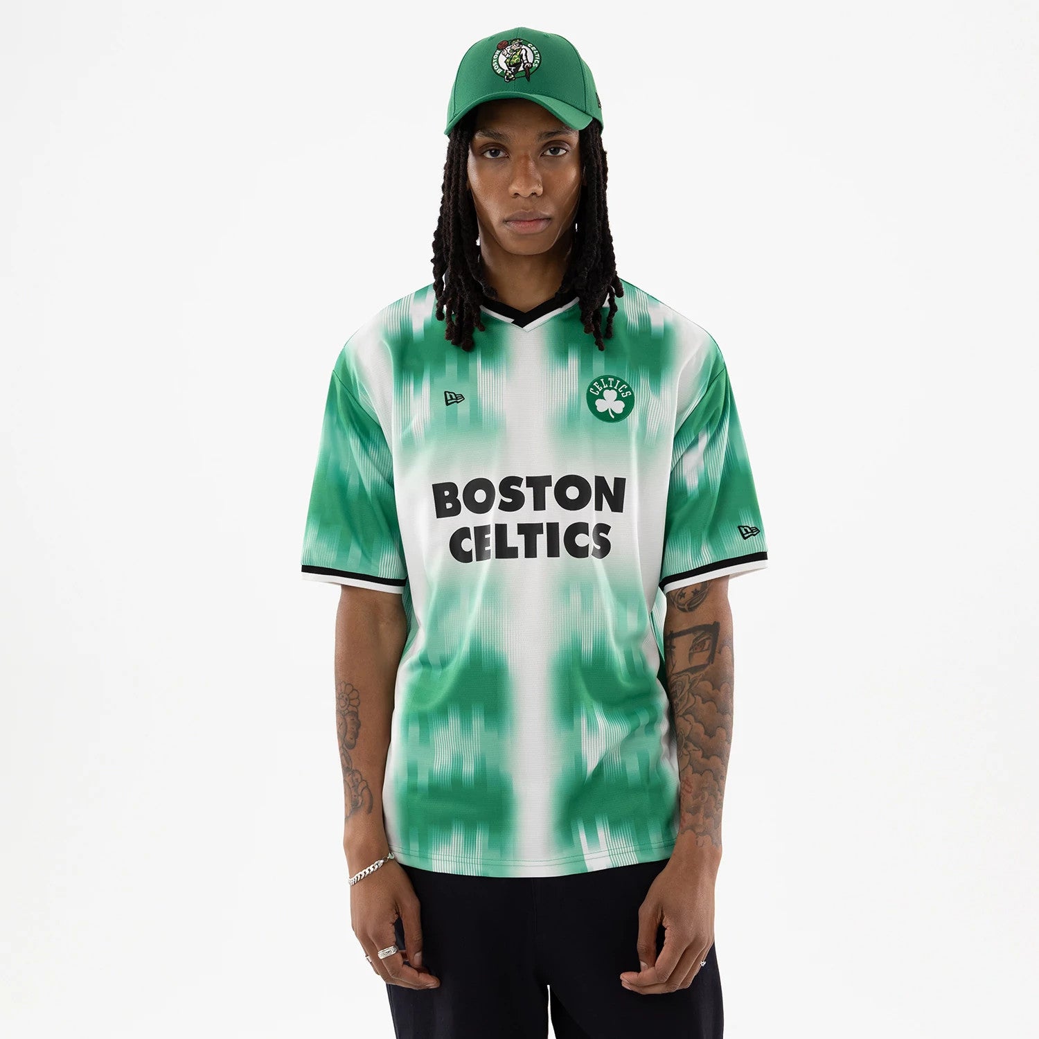 The model is wearing this NBA Boston Celtics Soccer Jersey in green. 1