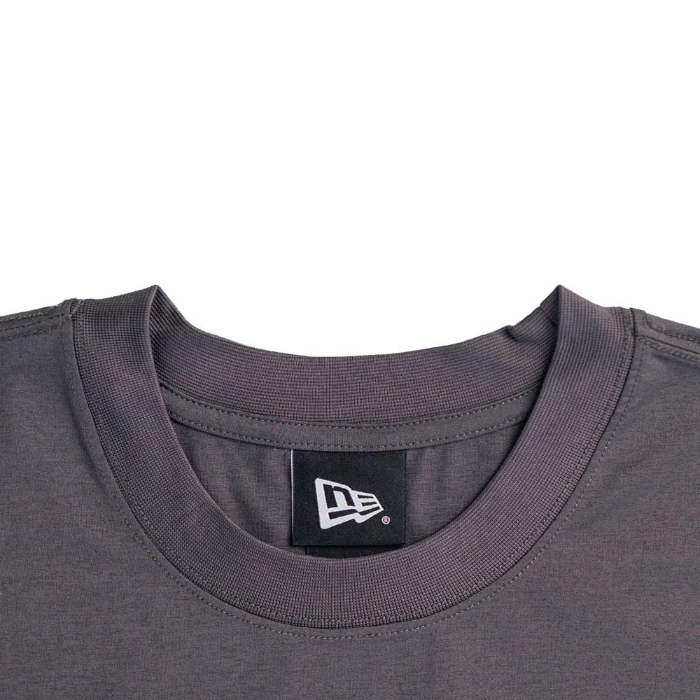 The model is wearing this New Era NEC Logo Oversized T-Shirt in black. 3