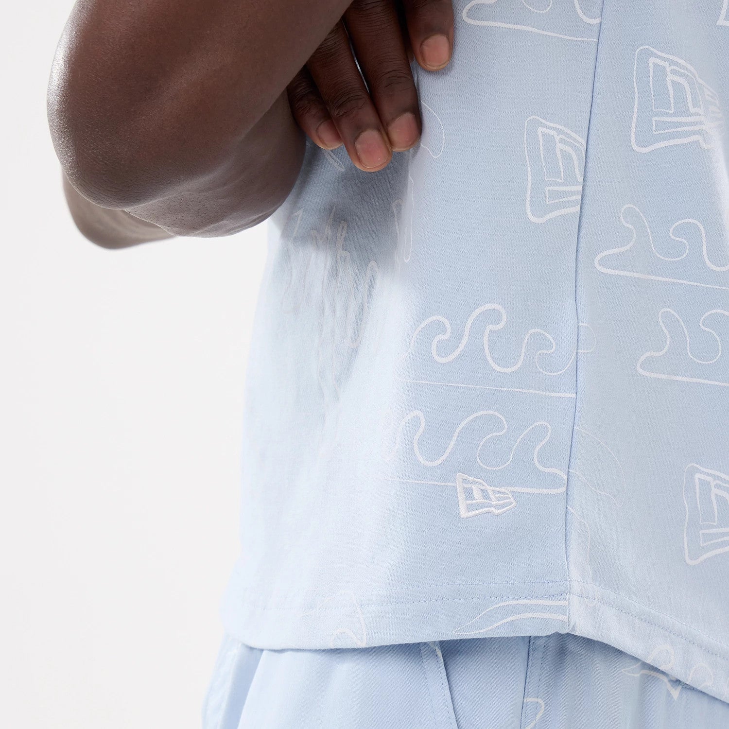 The model is wearing this New Era Resort Tank Top in blue. 4