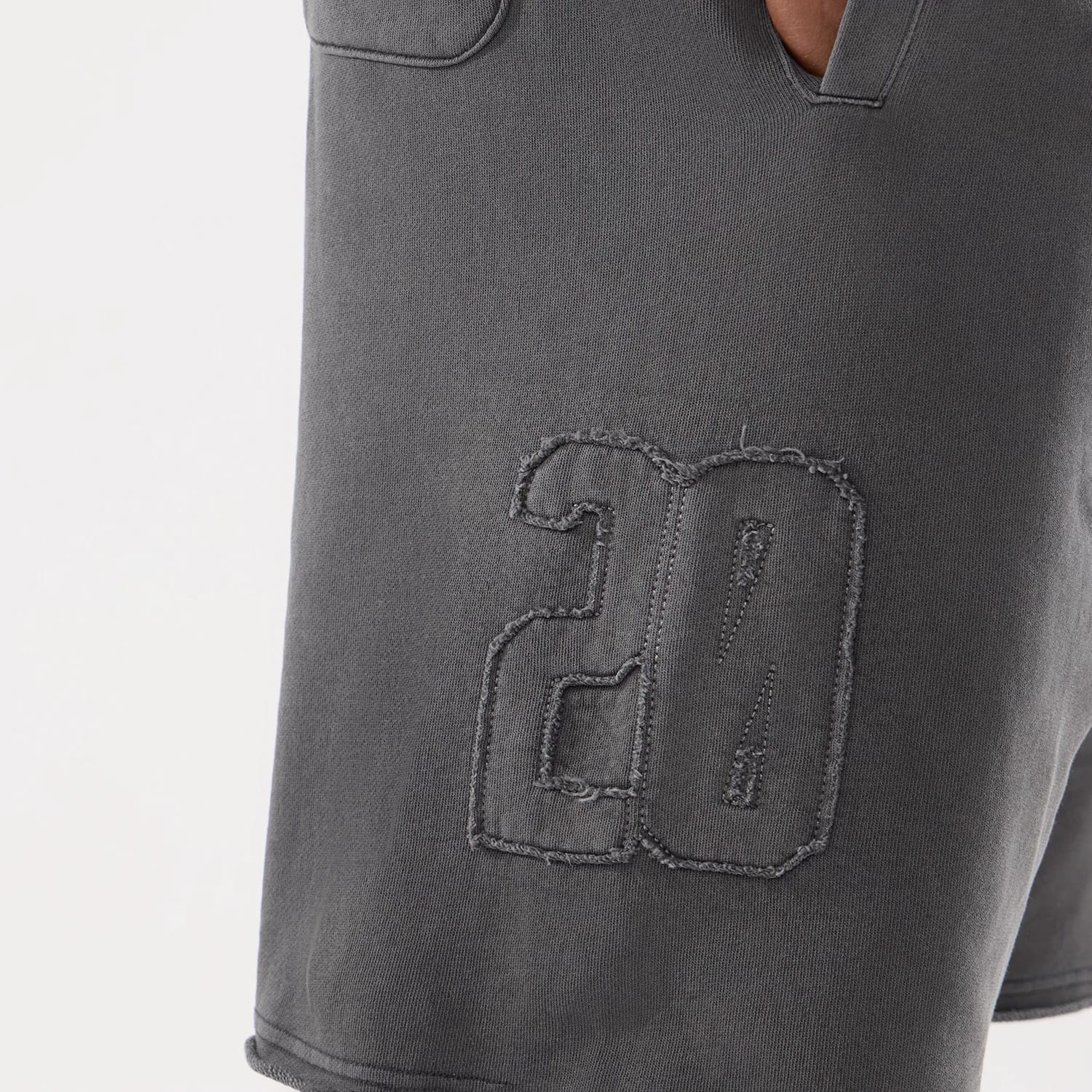 The model is wearing this New Era Street Archived Oversized Shorts in black. 4