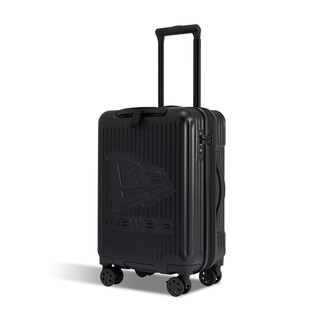 New Era Black Wheeled Cabin Case, three-quarter view showing a ribbed black shell with a raised New Era logo on the front, a telescopic handle and side handle, and four pivoting wheels at the base.