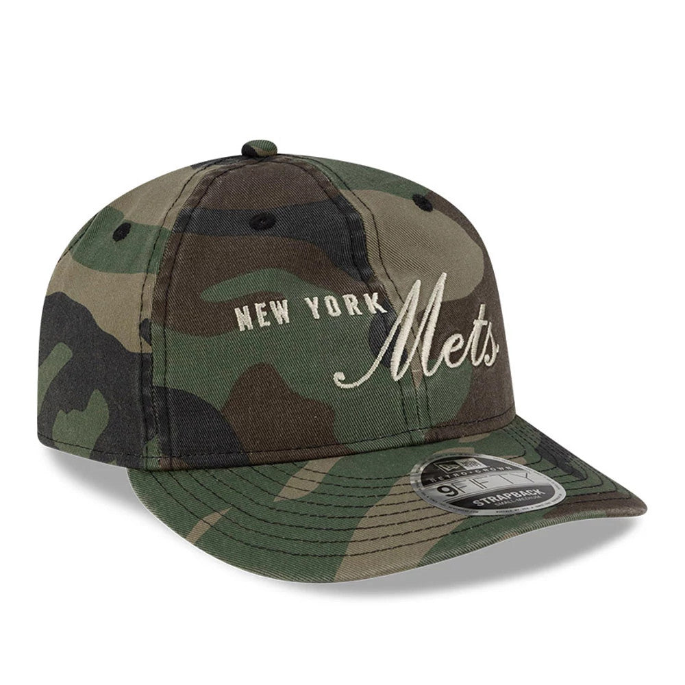 New York Mets Thisisneverthat X MLB Woodland Camo Retro Crown New Era 9FIFTY Cap, three-quarter view showing cream embroidered script Mets logo on front panel with black eyelet detail and 9FIFTY size sticker on the camo visor.