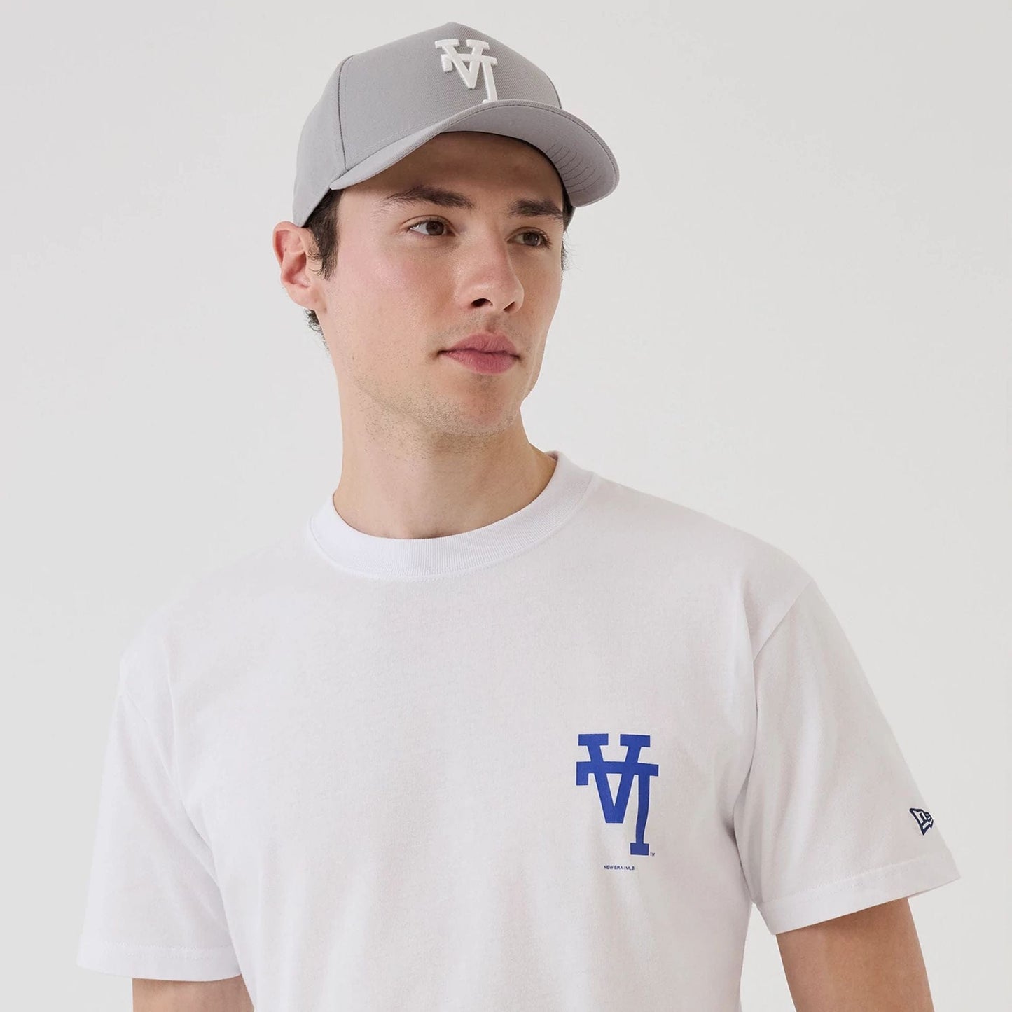 The model is wearing this MLB Upside Down LA Dodgers T-Shirt in white. 7