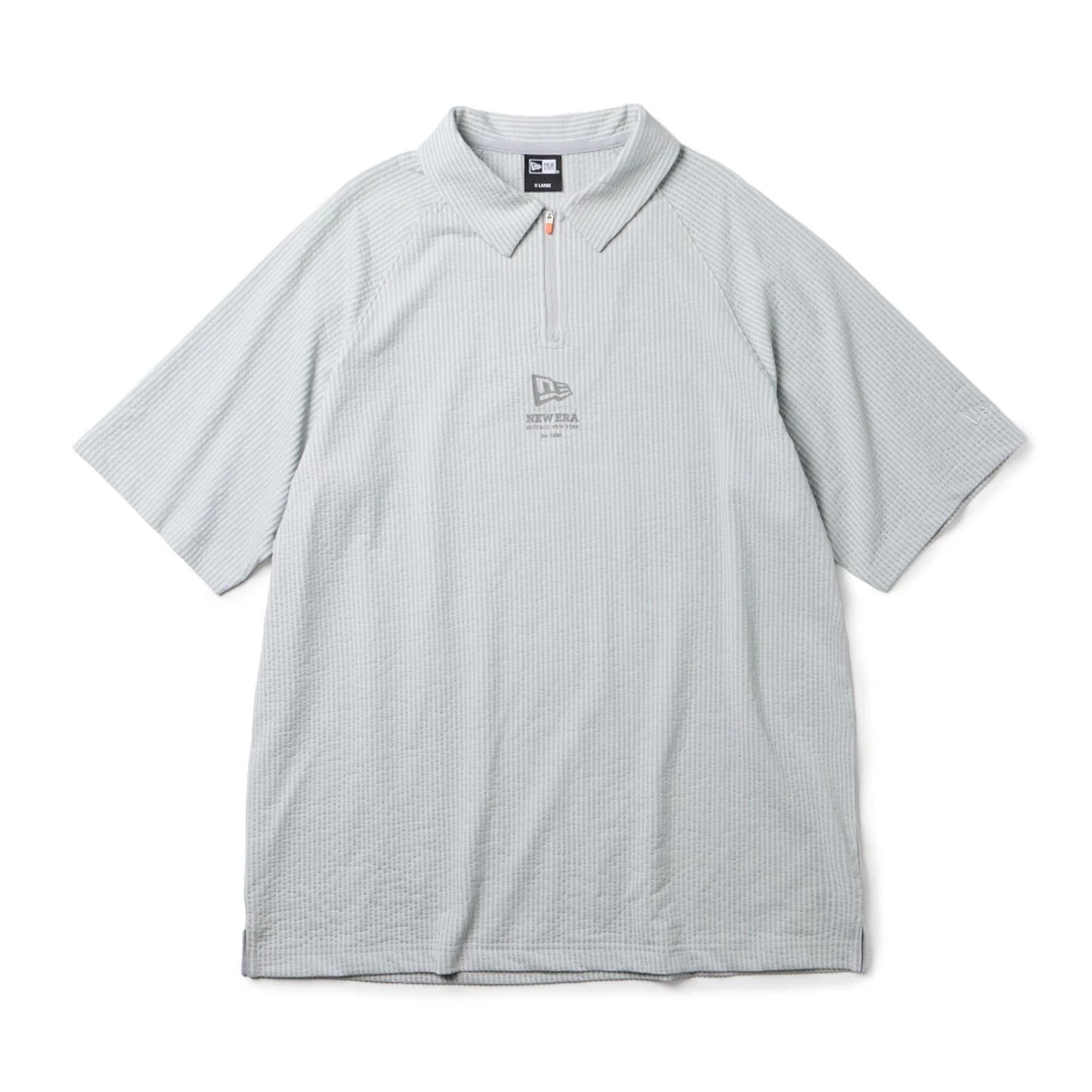 The model is wearing this New Era Seersucker Polo T-Shirt in grey. 1