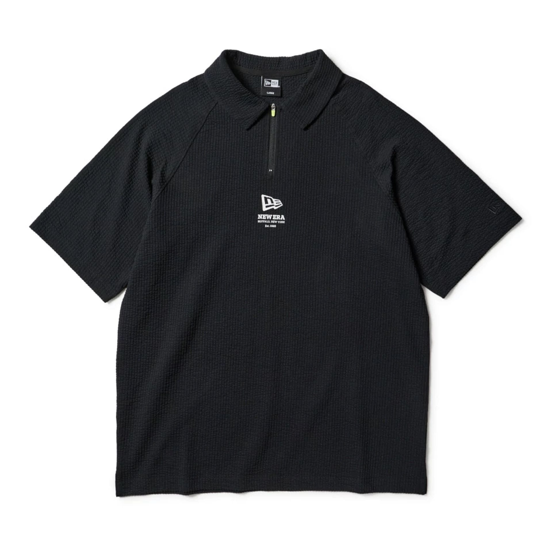 The model is wearing this New Era Seersucker Polo T-Shirt in black. 1