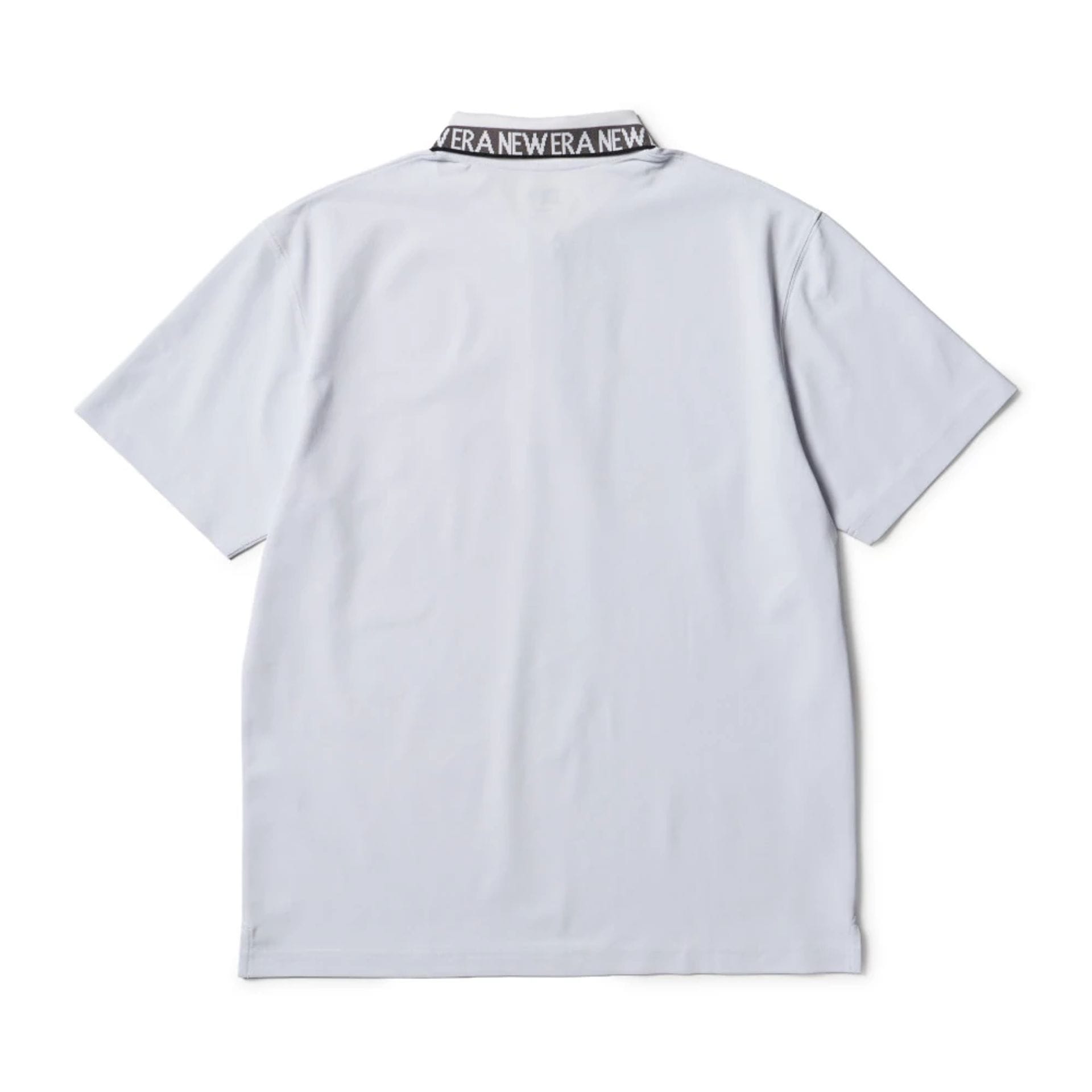 The model is wearing this New Era Kanoko Polo T-Shirt in white. 2
