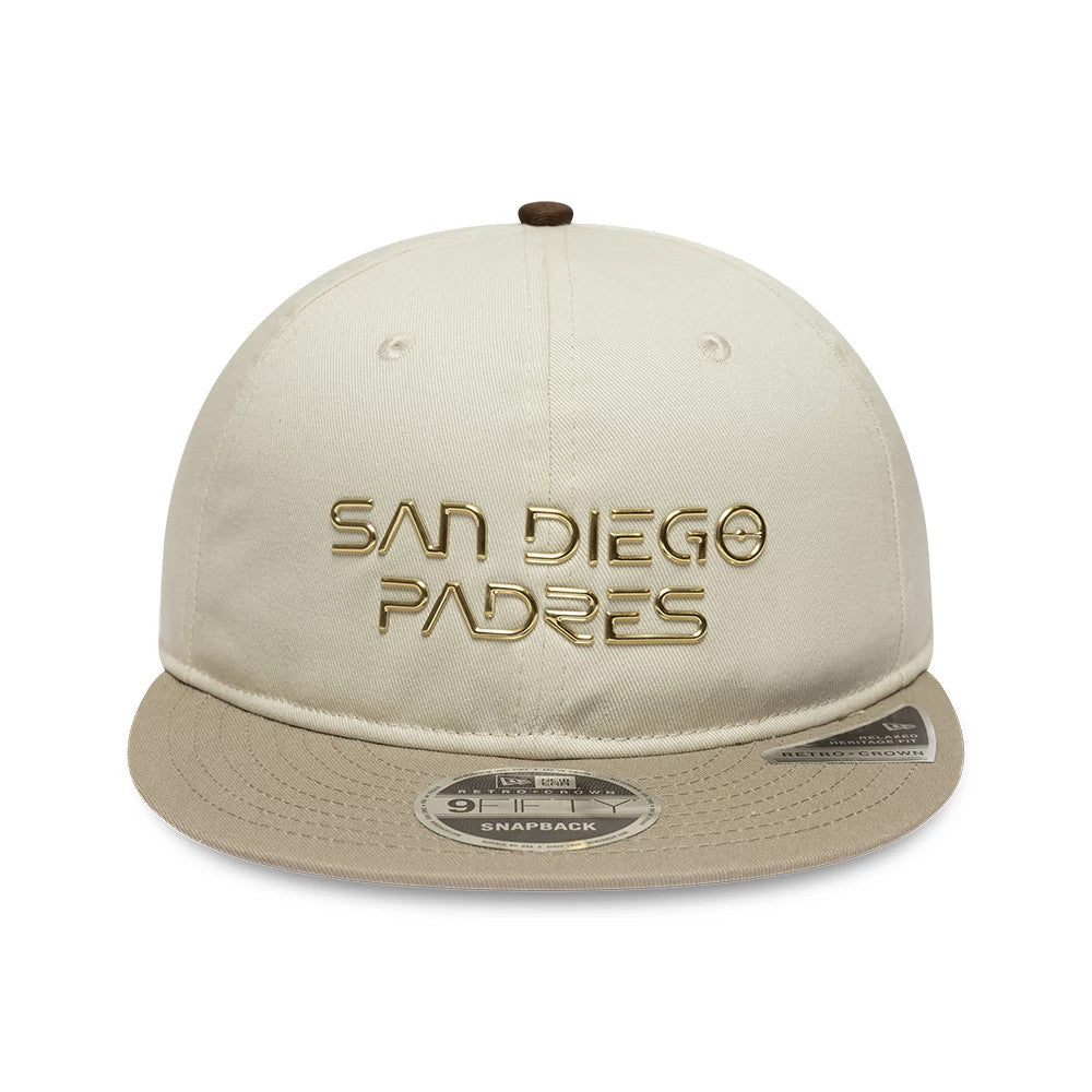 San Diego Padres Hajime Sorayama X MLB Cream Retro Crown New Era 9FIFTY Adjustable Cap, front view showing raised gold embroidered lettering on the front panel and a 9FIFTY size sticker on the cream and beige flat visor.