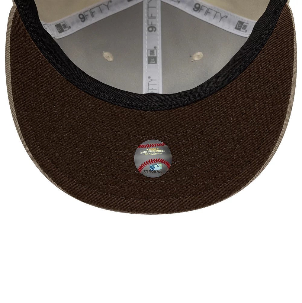 San Diego Padres Hajime Sorayama X MLB Cream Retro Crown New Era 9FIFTY Adjustable Cap, inside view showing the brown undervisor with an official MLB holographic sticker, grey taping with New Era branding, and cream-coloured sweatband.