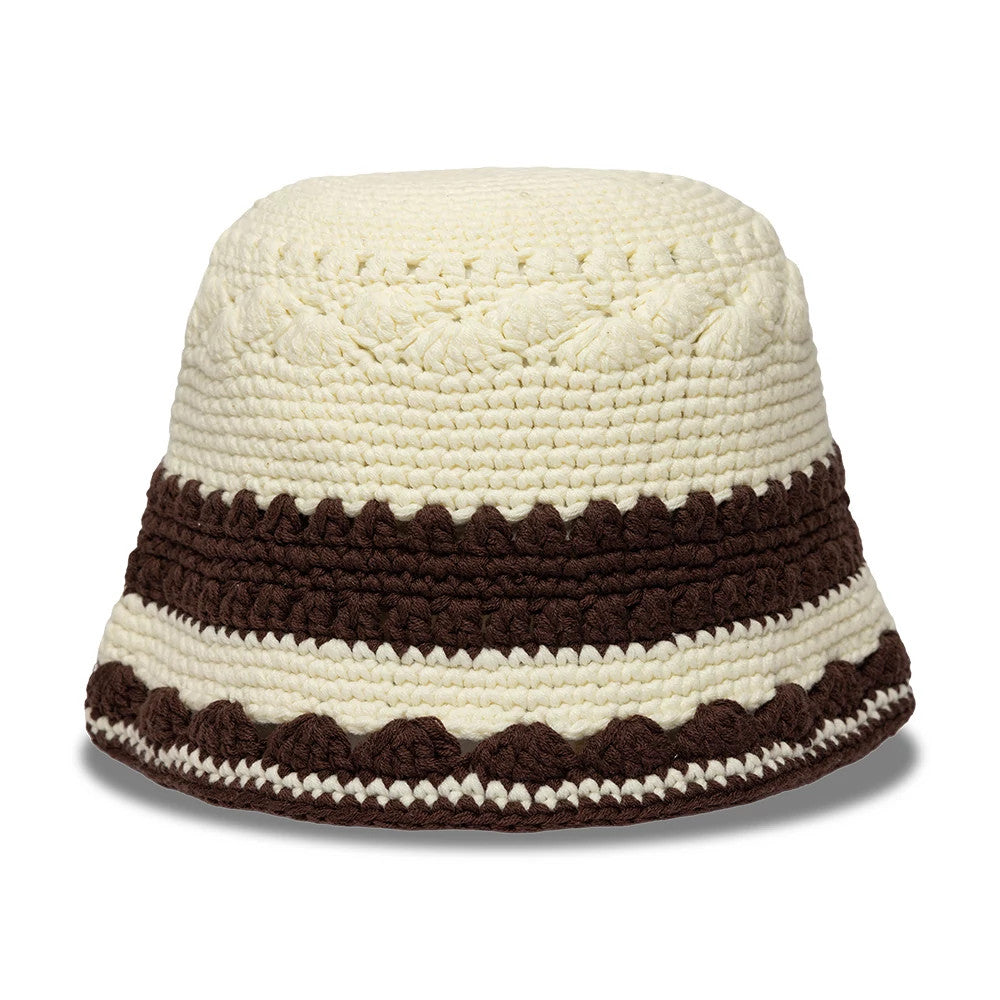 New Era Crochet Border White Explorer Bucket Hat, front view showing intricate white and brown crochet patterns with alternating textured borders wrapping around the structured design.
