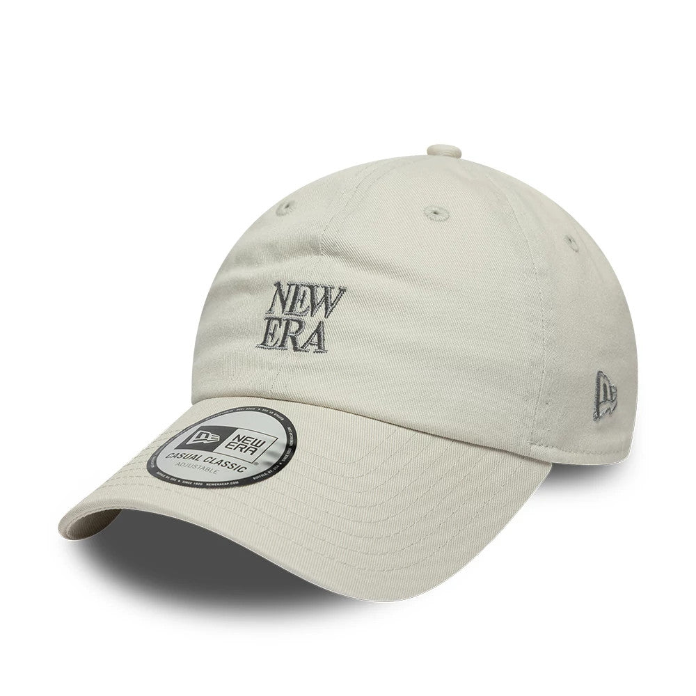 New Era Square Logo Cream Casual Classic Adjustable Cap, front view showing raised grey embroidered New Era text logo on front panel, matching top button, curved visor and New Era size sticker, with New Era flag logo on the left side.