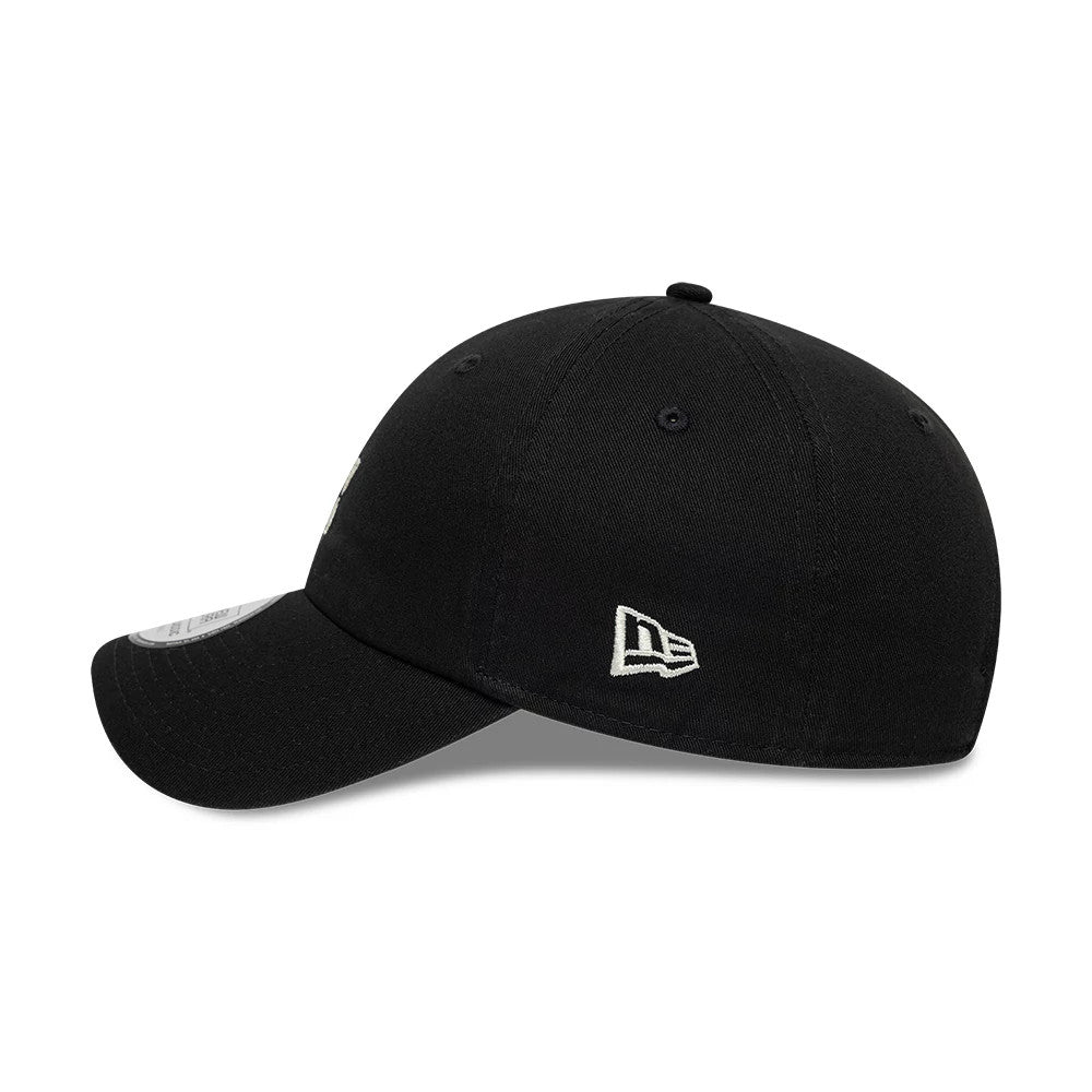 New Era Square Logo Black Casual Classic Adjustable Cap, side view with embroidered New Era flag logo on the left side of the black crown, featuring a curved visor and a size sticker on the top.
