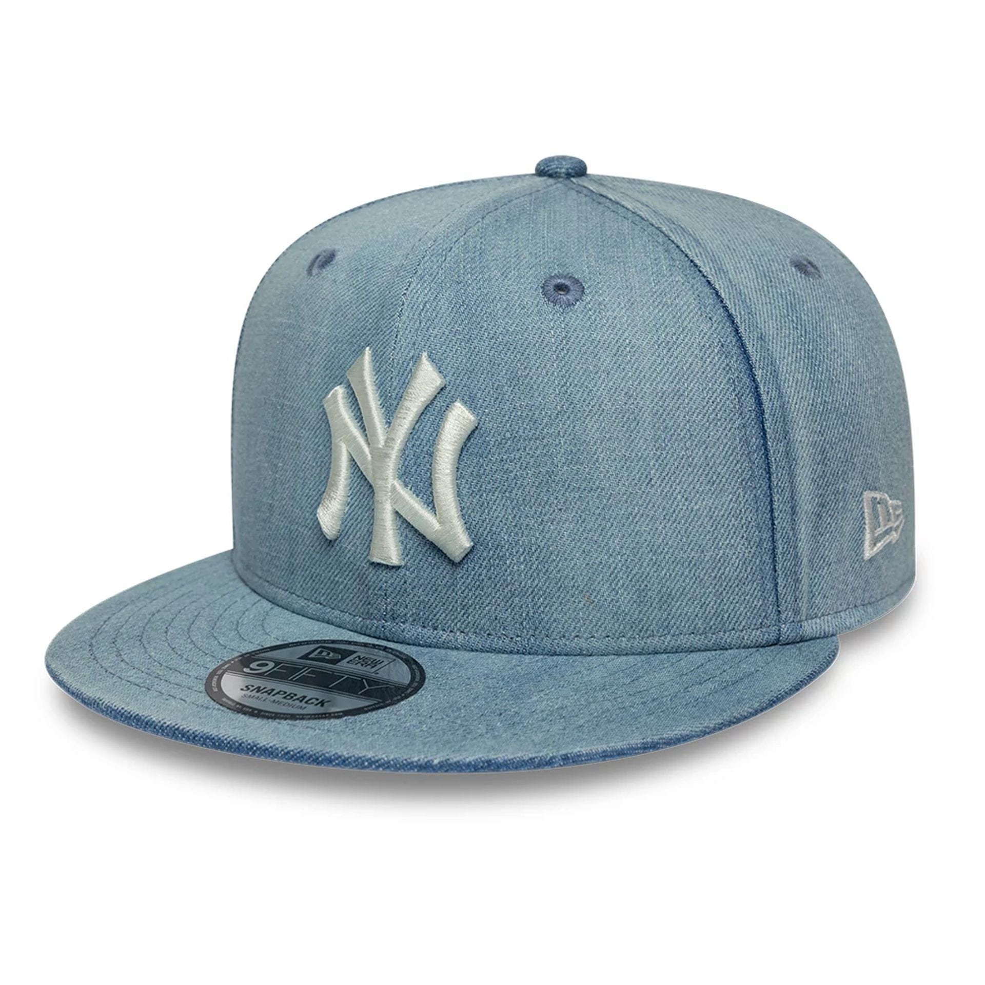 Pictured is this MLB Washed Denim New York Yankees 9FIFTY Snapback cap in navy. 1