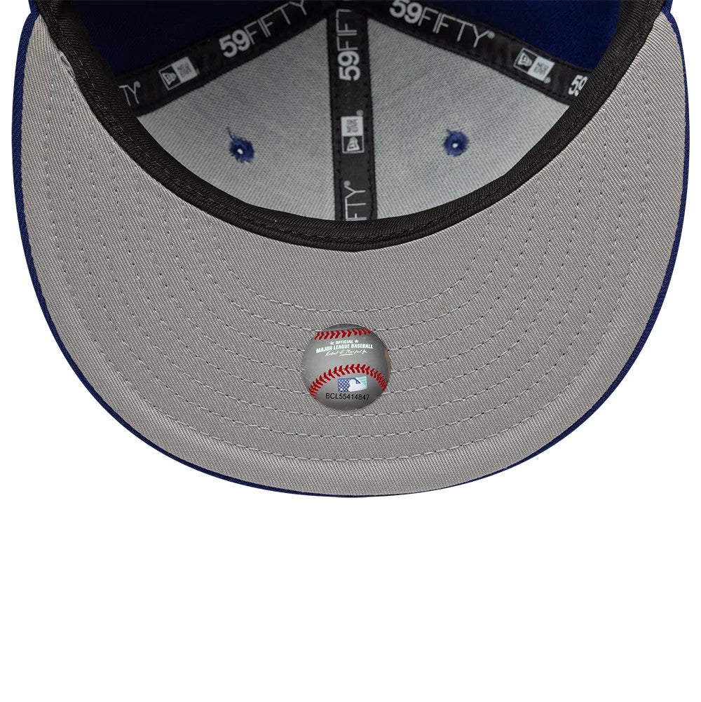 LA Dodgers Hajime Sorayama X MLB Dark Blue New Era 59FIFTY Fitted Cap, inside view showing black and white 59FIFTY taping, grey undervisor with a baseball-themed holographic sticker, and blue eyelets on the crown.