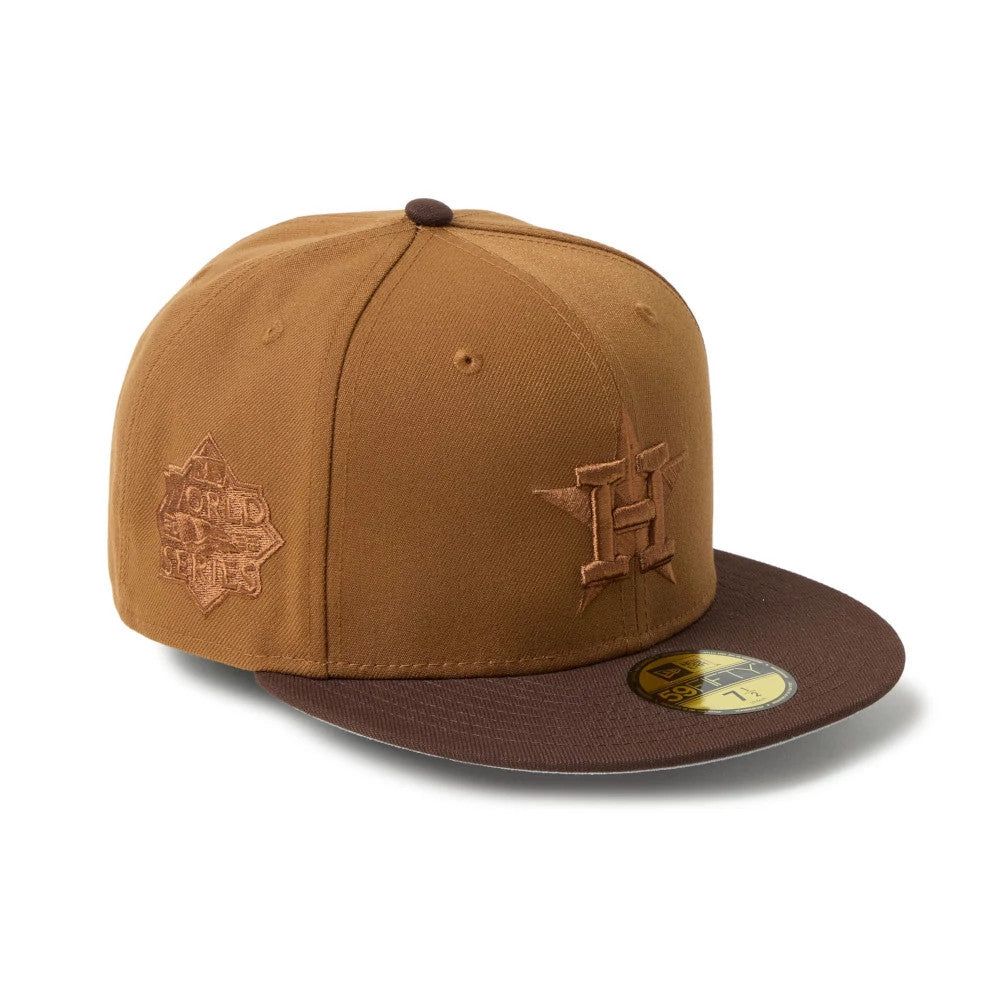 Houston Astros MLB Brown New Era 59FIFTY Fitted Cap, three-quarter view with brown raised embroidery H logo on the front panel, brown flat visor with gold 59FIFTY size sticker, and World Series logo on the side.
