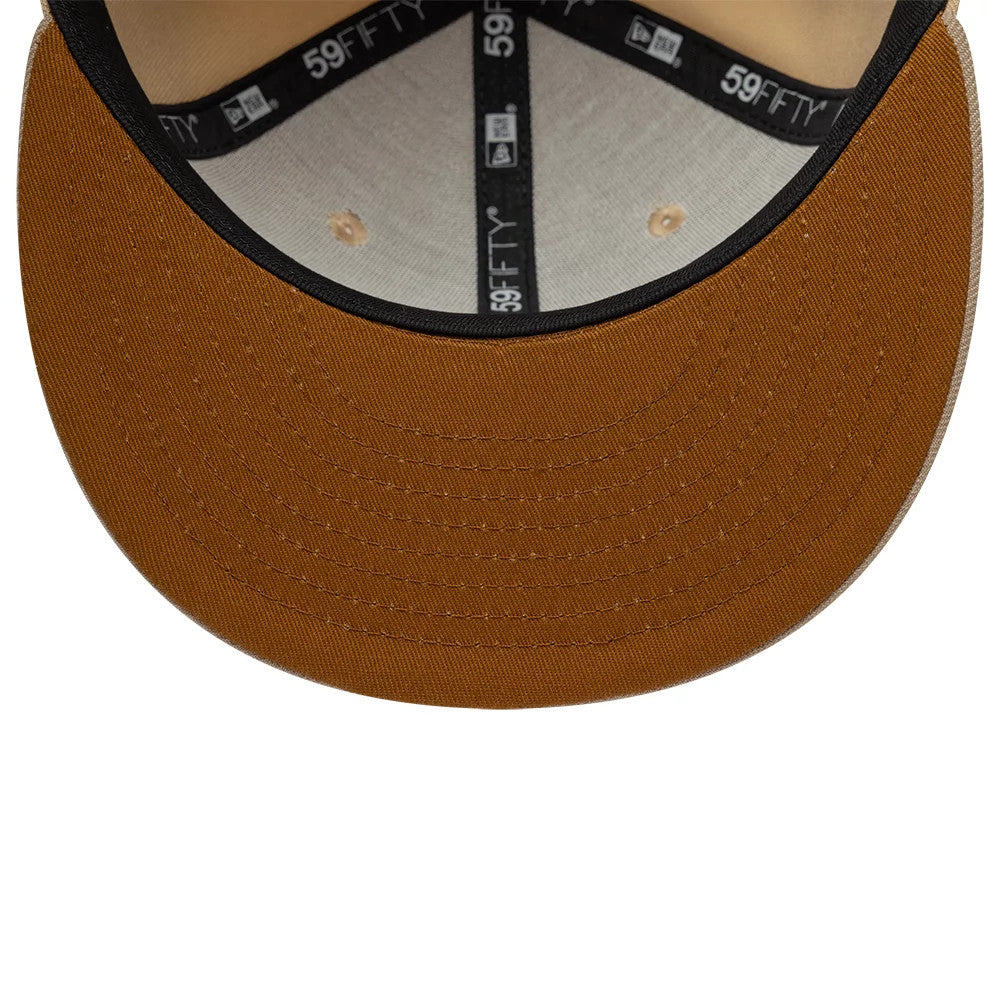 New Era Mocha Mousse Light Beige 59FIFTY Fitted Cap, inside view showing the black taping with white logos, a mocha mousse undervisor, and beige sweatband with the top button matching the cap's exterior.