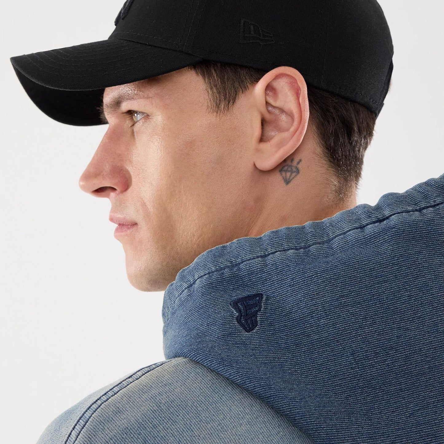 The model is wearing this New Era Washed Full Zip Hoodie in blue. 7