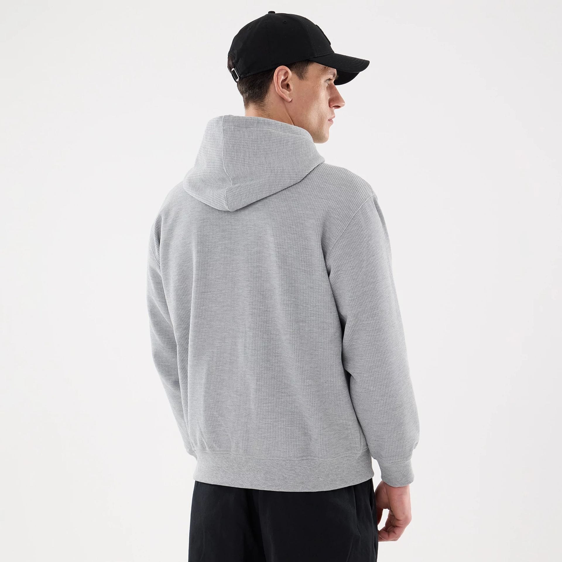 The model is wearing this New Era Waffle Full Zip Hoodie in grey. 2