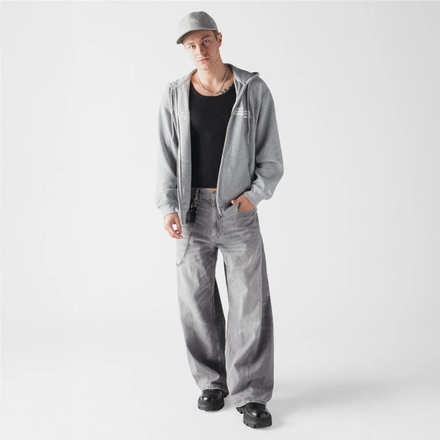 The model is wearing this New Era Waffle Full Zip Hoodie in grey. 6