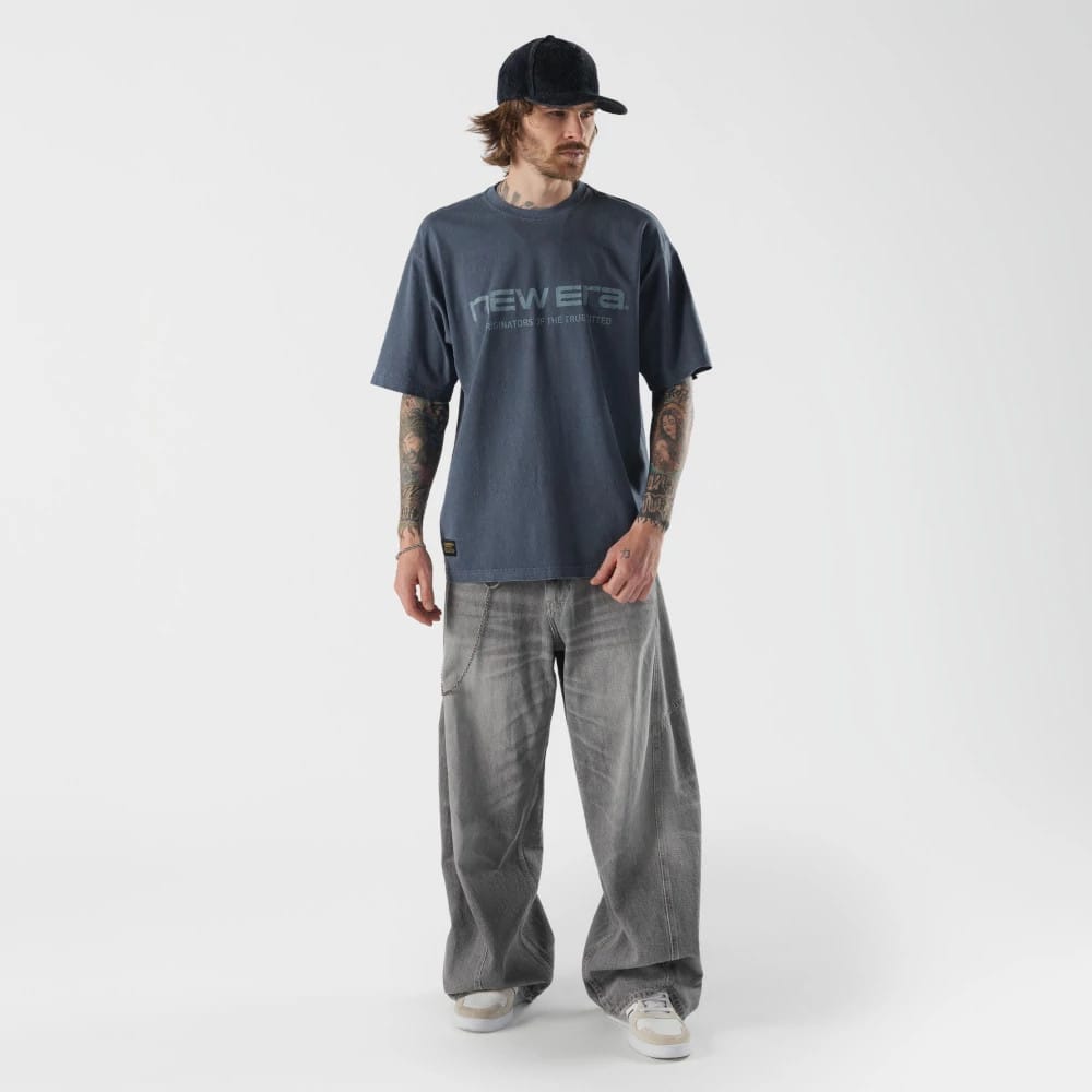 The model is wearing this New Era Originators T-Shirt in navy. 5