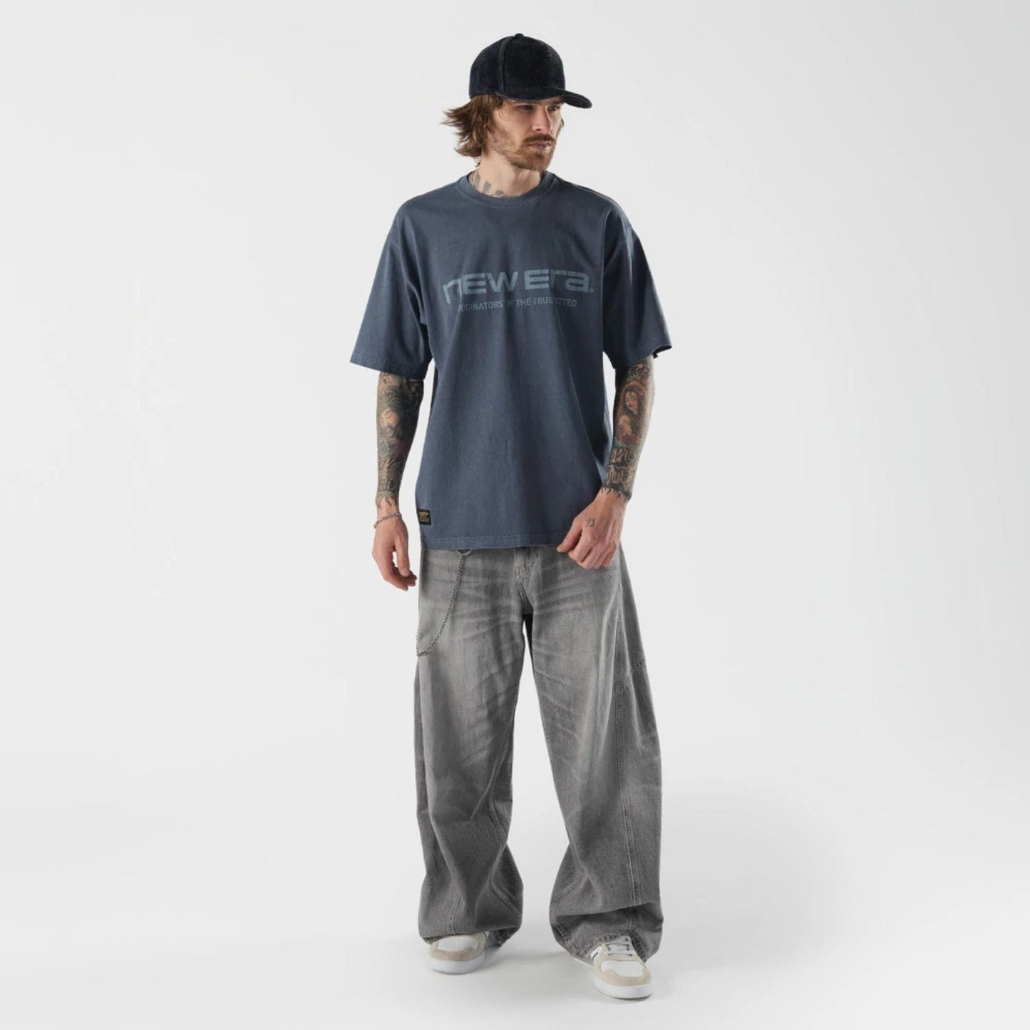 The model is wearing this New Era Originators T-Shirt in navy. 5