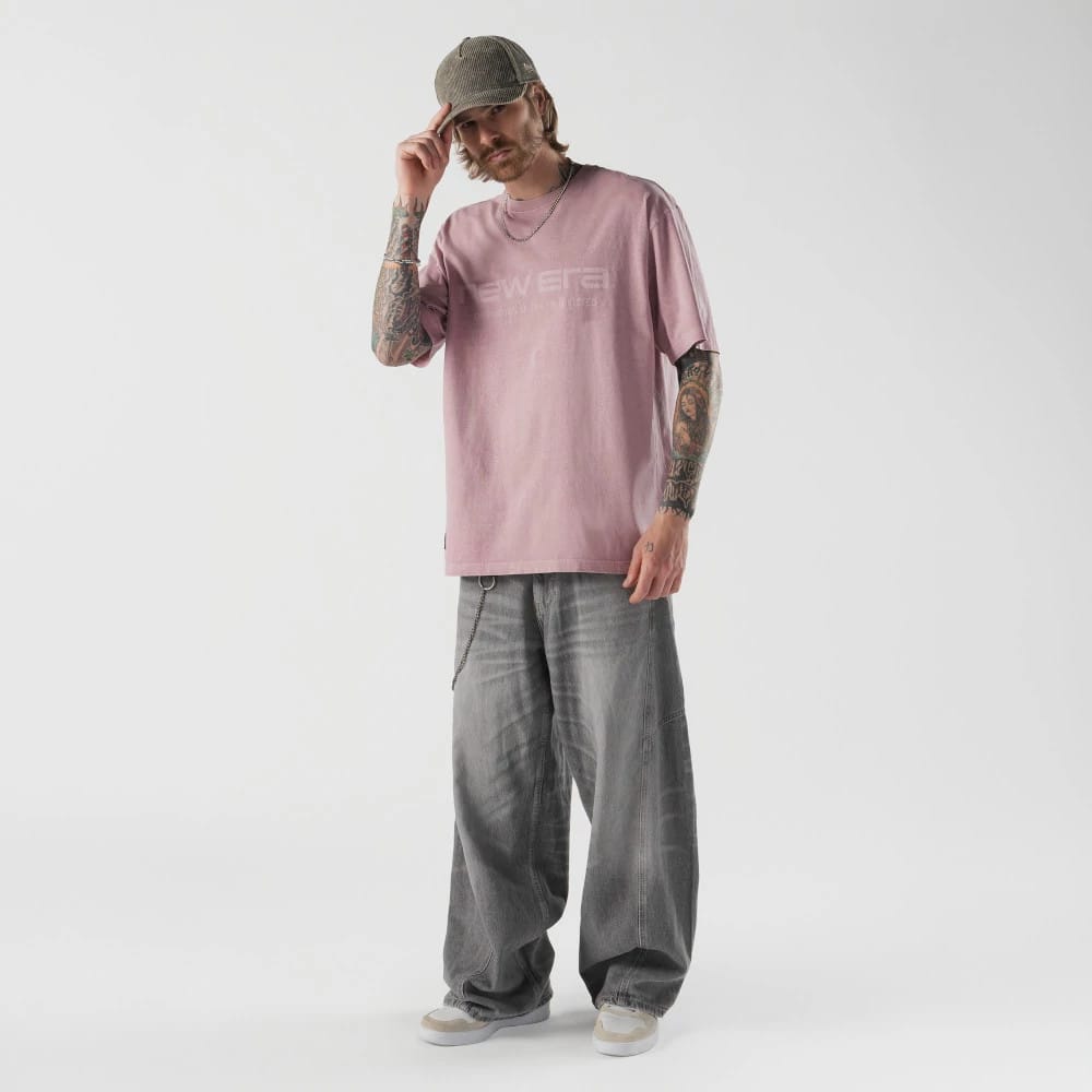 The model is wearing this New Era Originators T-Shirt in pink. 5