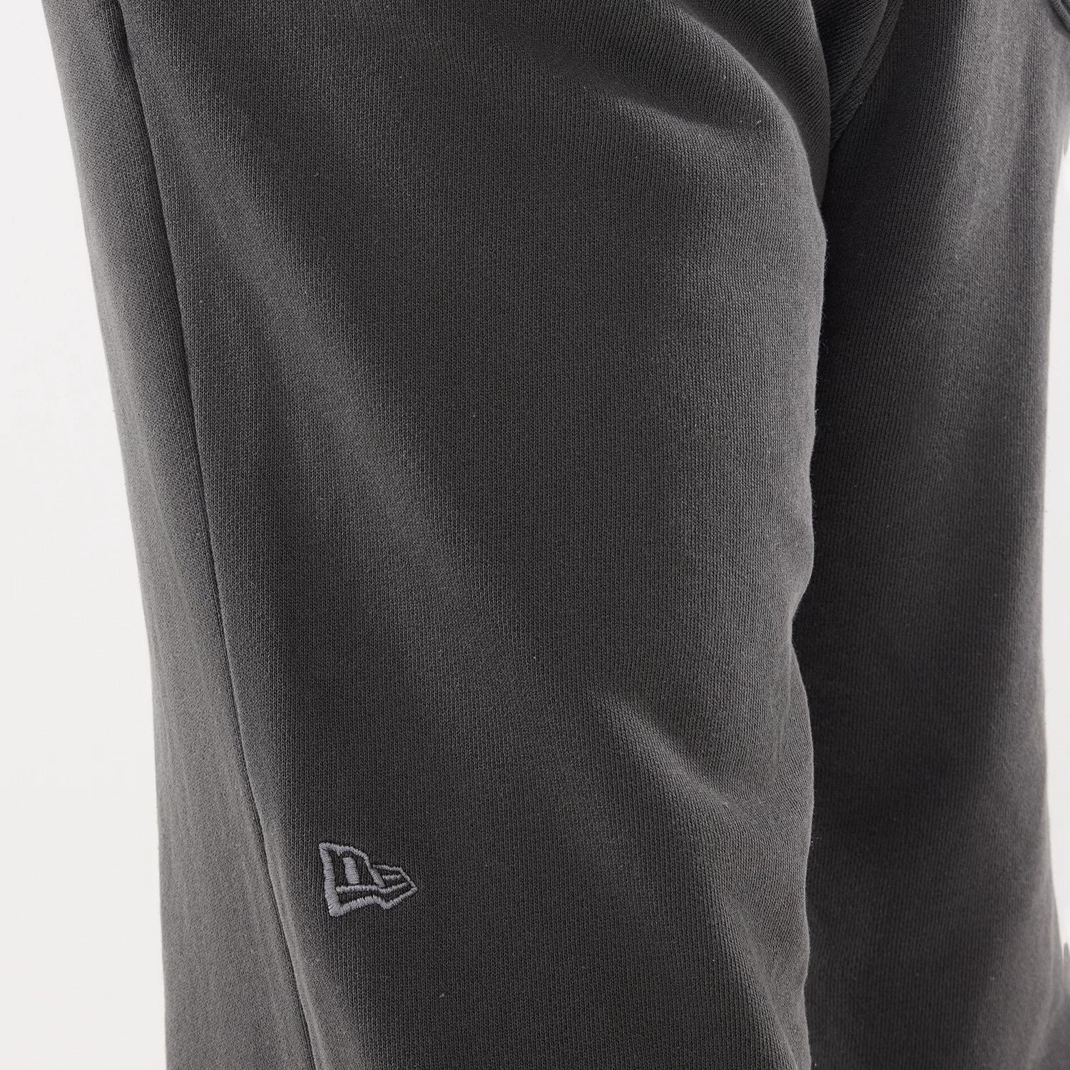 The model is wearing this New Era Originators Straight Leg Joggers in black. 4