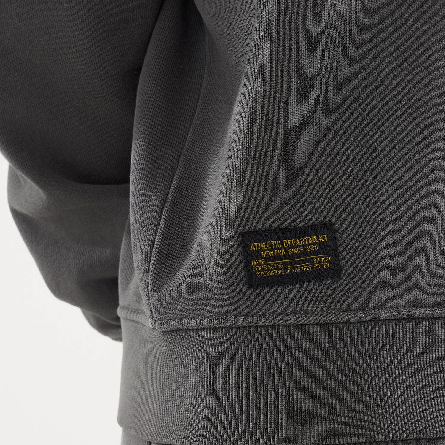 The model is wearing this New Era Originators Crew Neck Sweater in black. 4