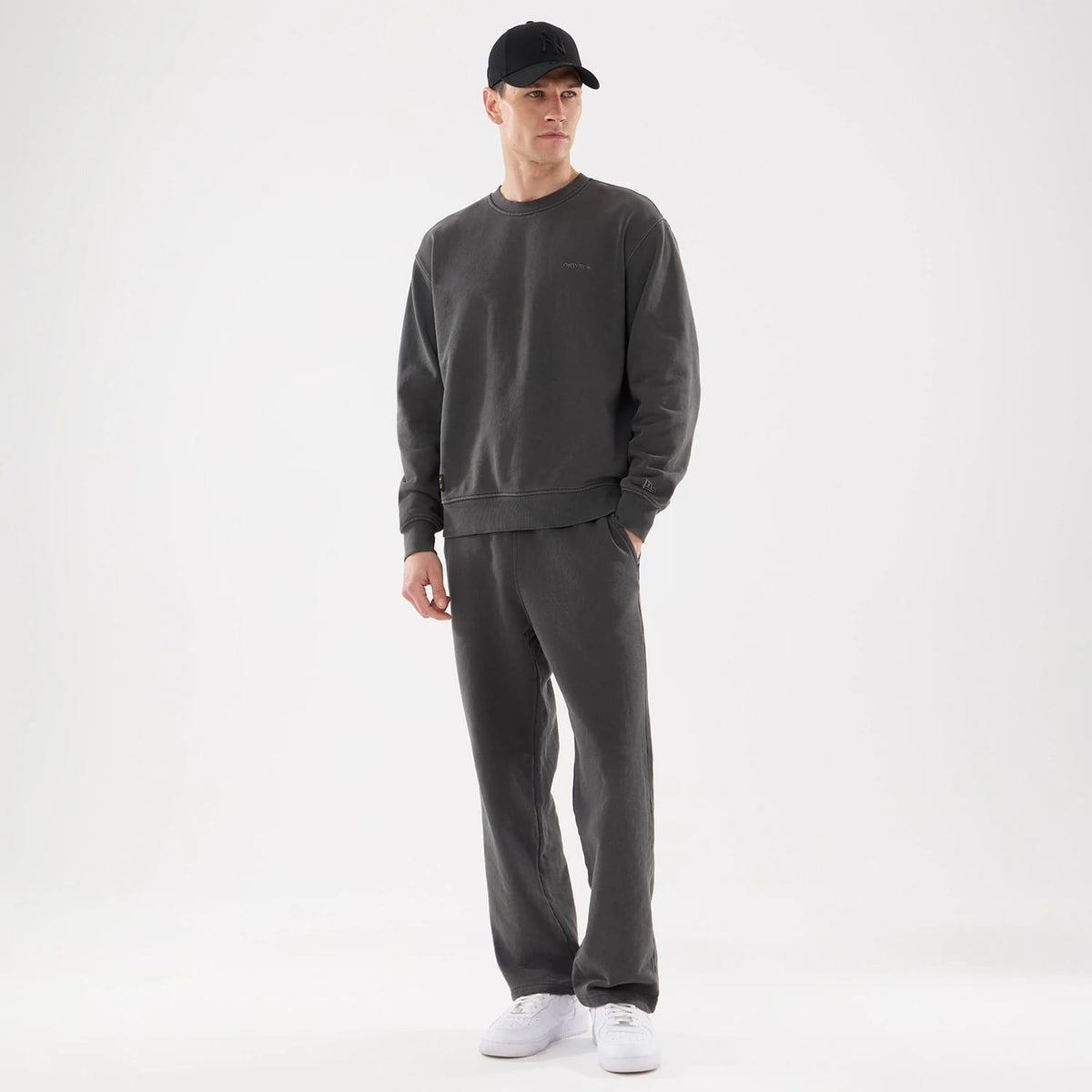 The model is wearing this New Era Originators Crew Neck Sweater in black. 8