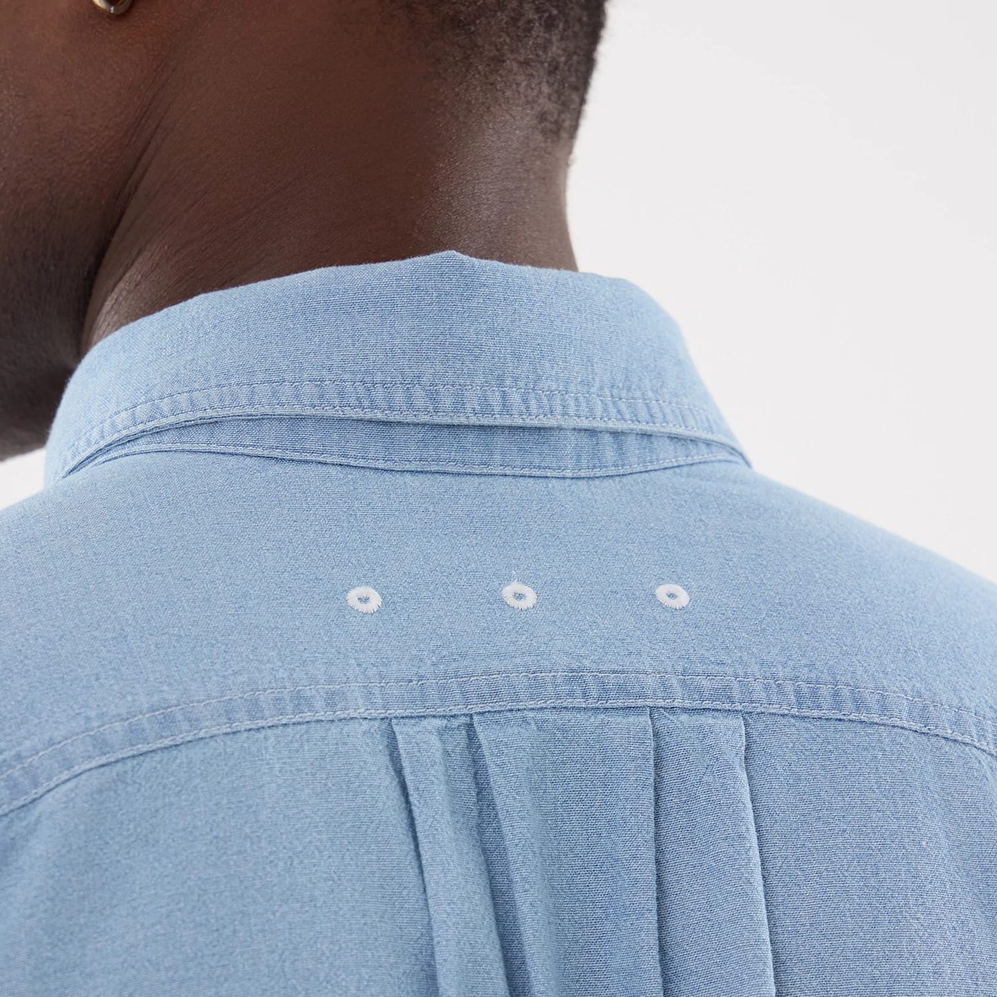 The model is wearing this New Era Originators Chambray Short Sleeve Shirt in bright blue. 7