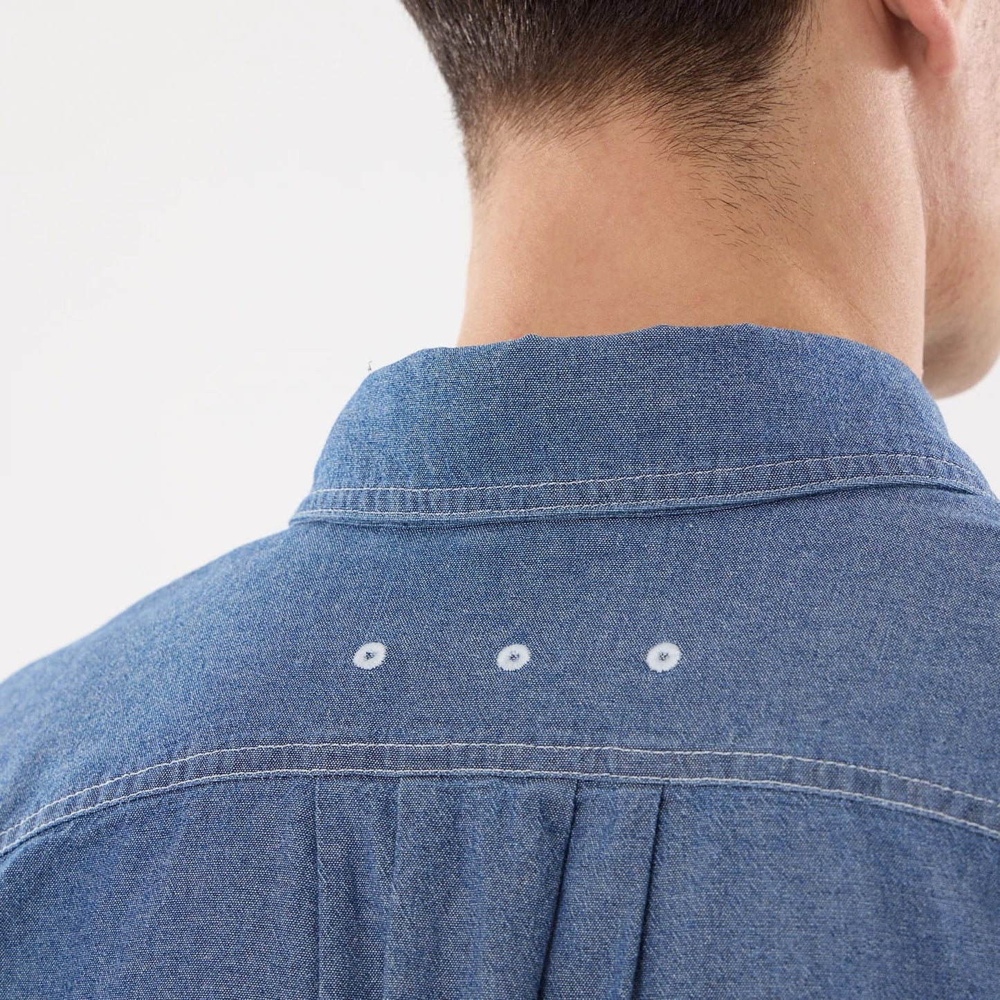 The model is wearing this New Era Originators Chambray Short Sleeve Shirt in dark blue. 7