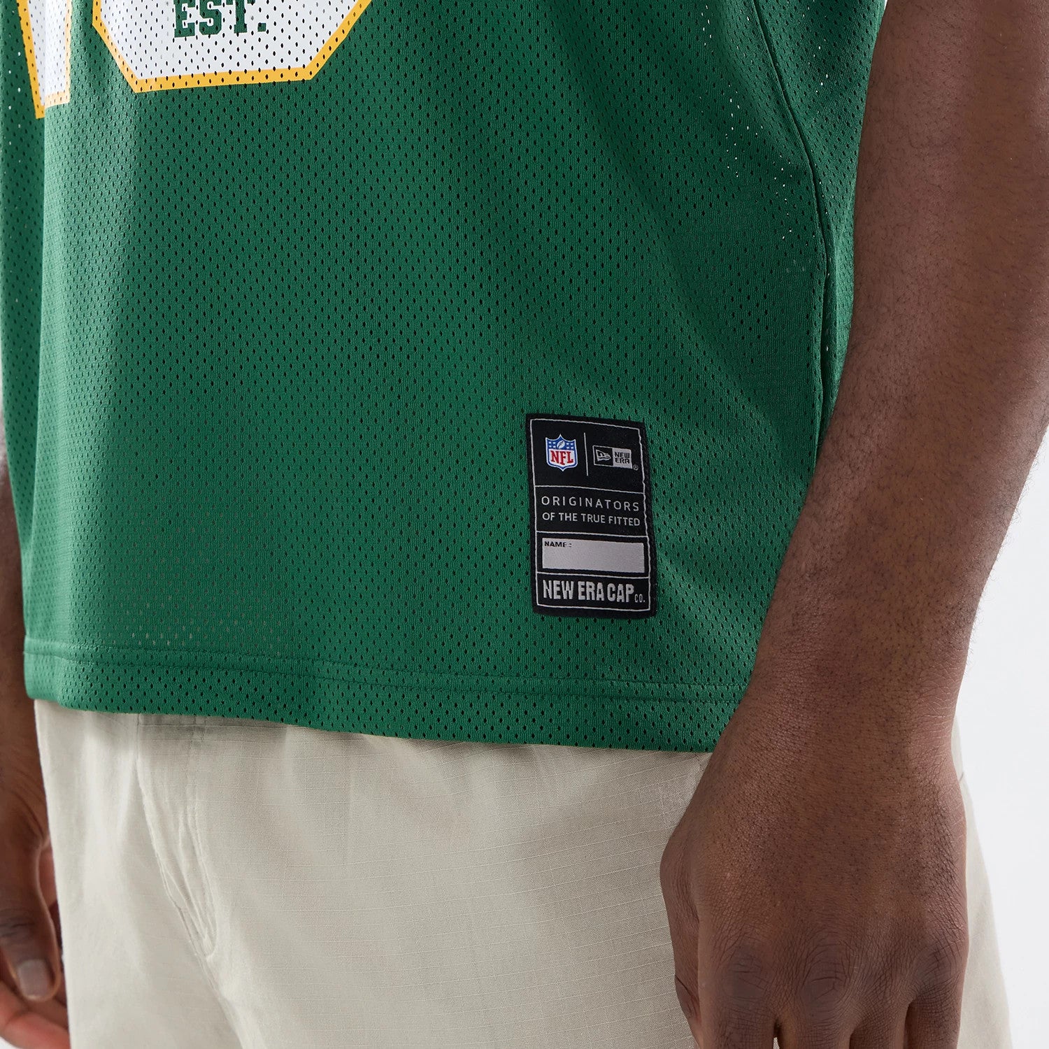 The model is wearing this NFL Green Bay Packers Mesh Jersey in green. 4