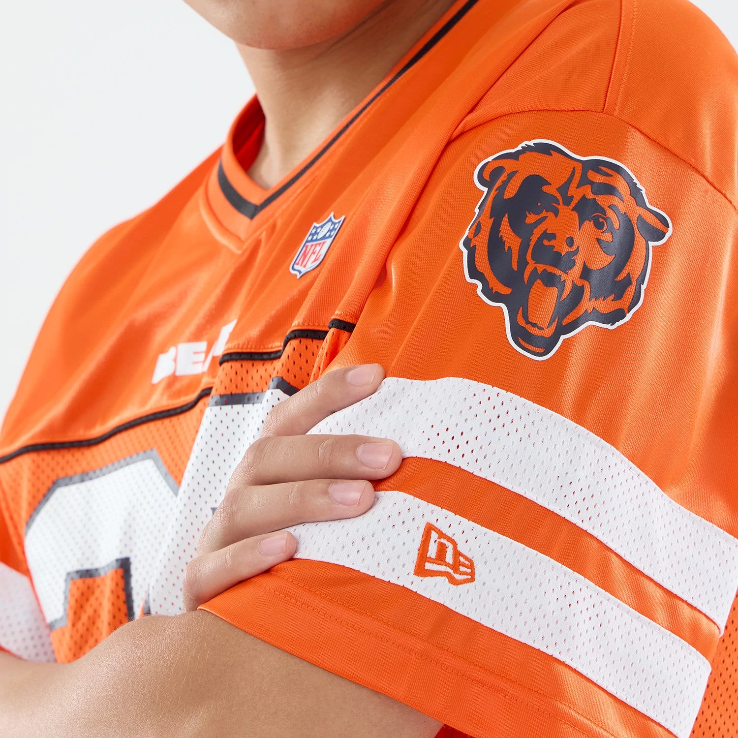 The model is wearing this NFL Chicago Bears Mesh Jersey in orange. 3