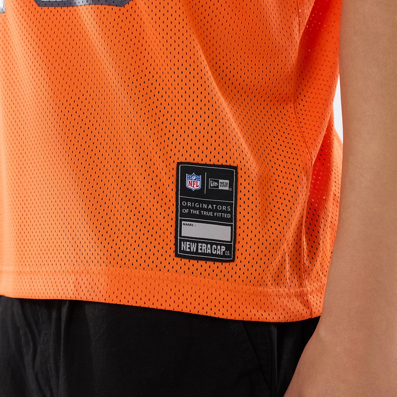 The model is wearing this NFL Chicago Bears Mesh Jersey in orange. 4