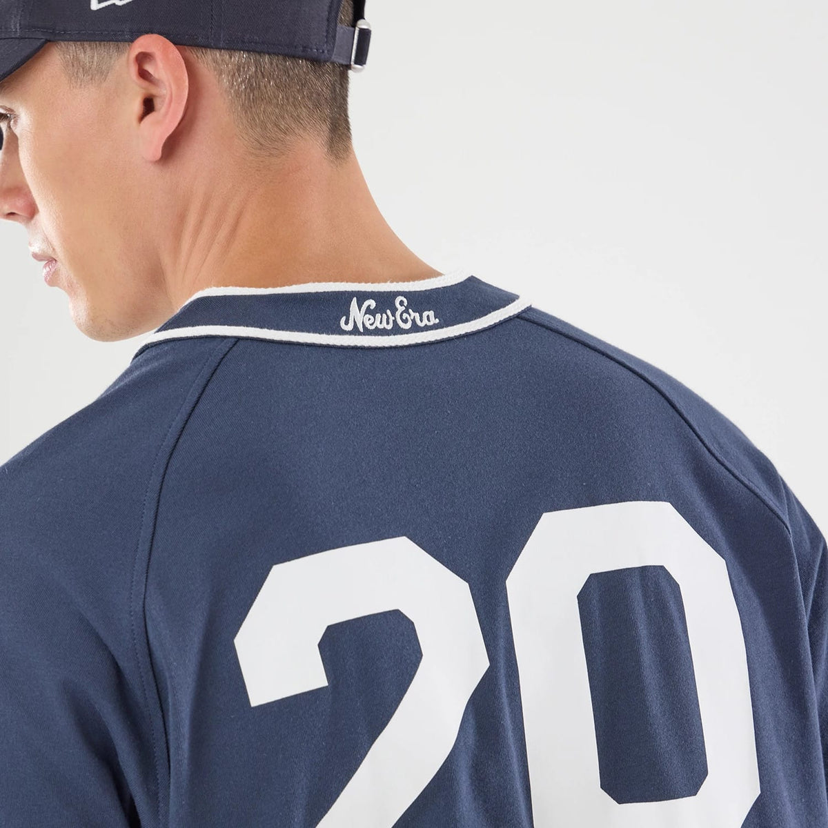 The model is wearing this New Era New York Jersey in navy. 7