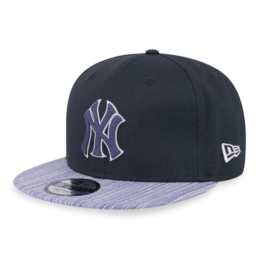 New York Yankees MLB Denim Patchwork Navy New Era 9FIFTY Snapback Adjustable Cap, front view with a raised navy NY logo on the front panel, a striped denim visor with a 9FIFTY size sticker, and the New Era flag logo on the left side.