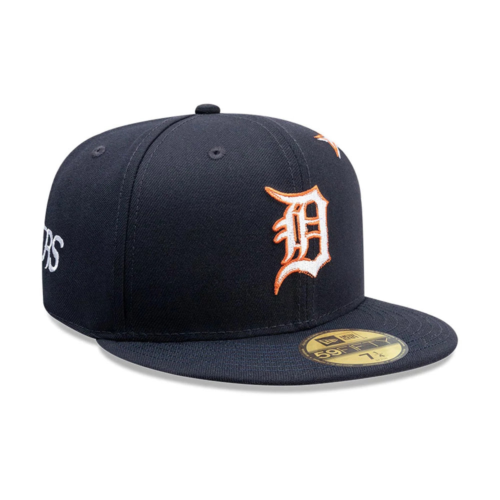 Detroit Tigers MLB Punkcore Navy New Era 59FIFTY Fitted Cap, three-quarter view with an orange embroidered Detroit D logo on the front panel and white embroidered text on the side, featuring a gold 59FIFTY size sticker on the flat navy visor.