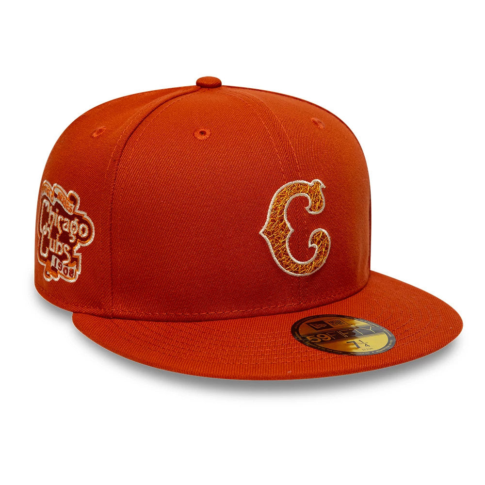Chicago Cubs MLB Pack Dark Orange New Era 59FIFTY Fitted Cap, three-quarter view showing the raised embroidered C logo in orange and white on the front panel, a side patch with Chicago Cubs 1908, and a gold 59FIFTY size sticker on the visor.