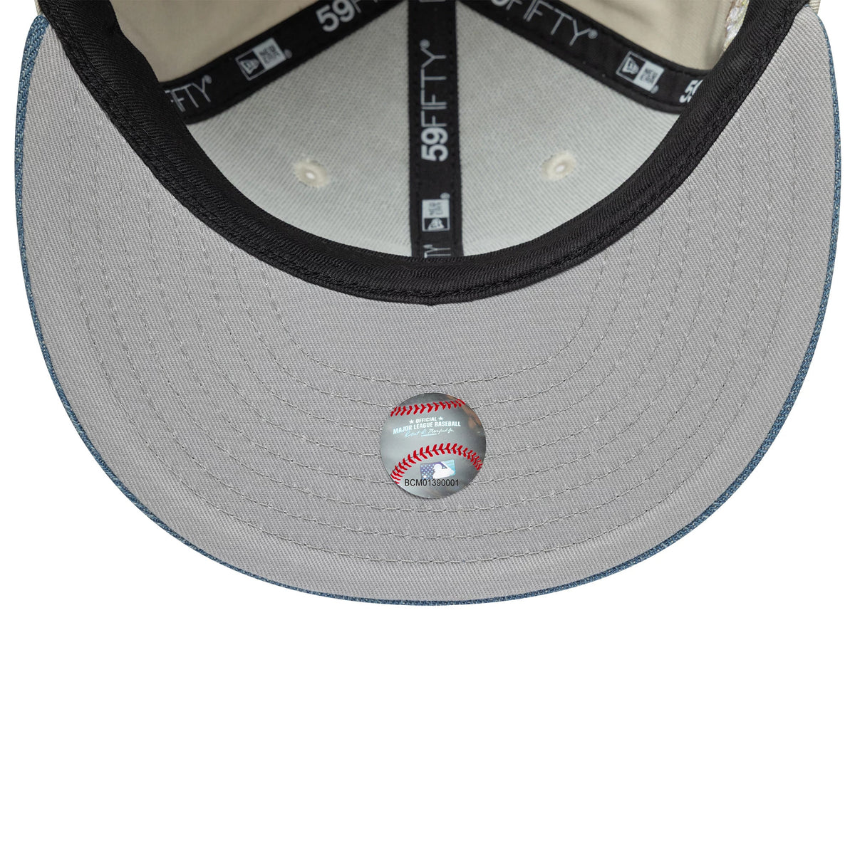 San Diego Padres MLB Denim Mix Beige New Era 59FIFTY Fitted Cap, inside view showing black taping with 59FIFTY branding, a grey undervisor, black sweatband, and highlighted baseball graphic at the centre underside of the visor.