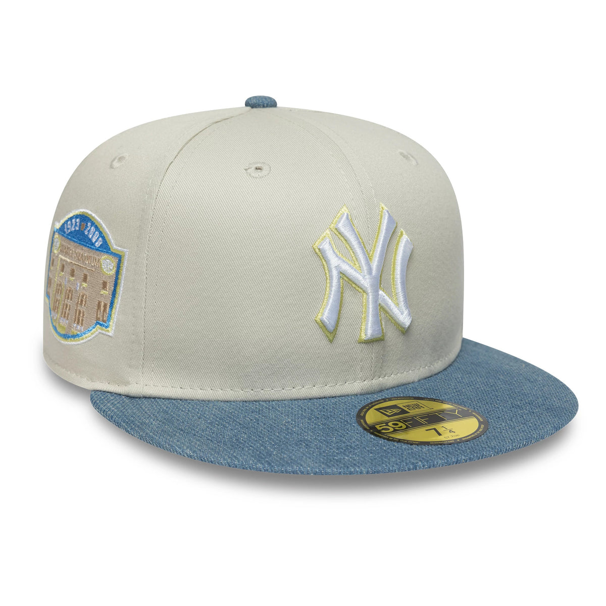 New York Yankees MLB Denim Mix Beige New Era 59FIFTY Fitted Cap, three-quarter view showing the white raised embroidered NY logo on the front panel, blue denim visor with gold 59FIFTY size sticker, and side stadium patch.