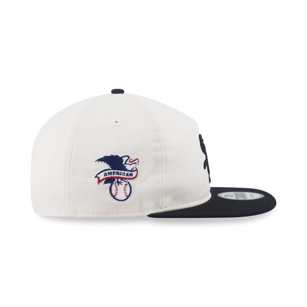 Chicago White Sox MLB Pack White & Black New Era 19TWENTY Adjustable Cap, side view showing the eagle patch with "American" lettering on the left panel, coupled with a black visor and white structured crown.