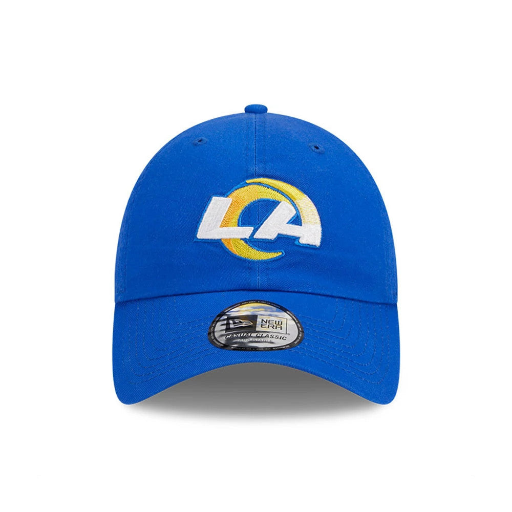 LA Rams NFL X Bad Bunny Bright Blue New Era Casual Classic Adjustable Cap, front view showing the white and yellow embroidered LA logo on the structured crown, with an adjustable strap and the Casual Classic size sticker on the curved visor.