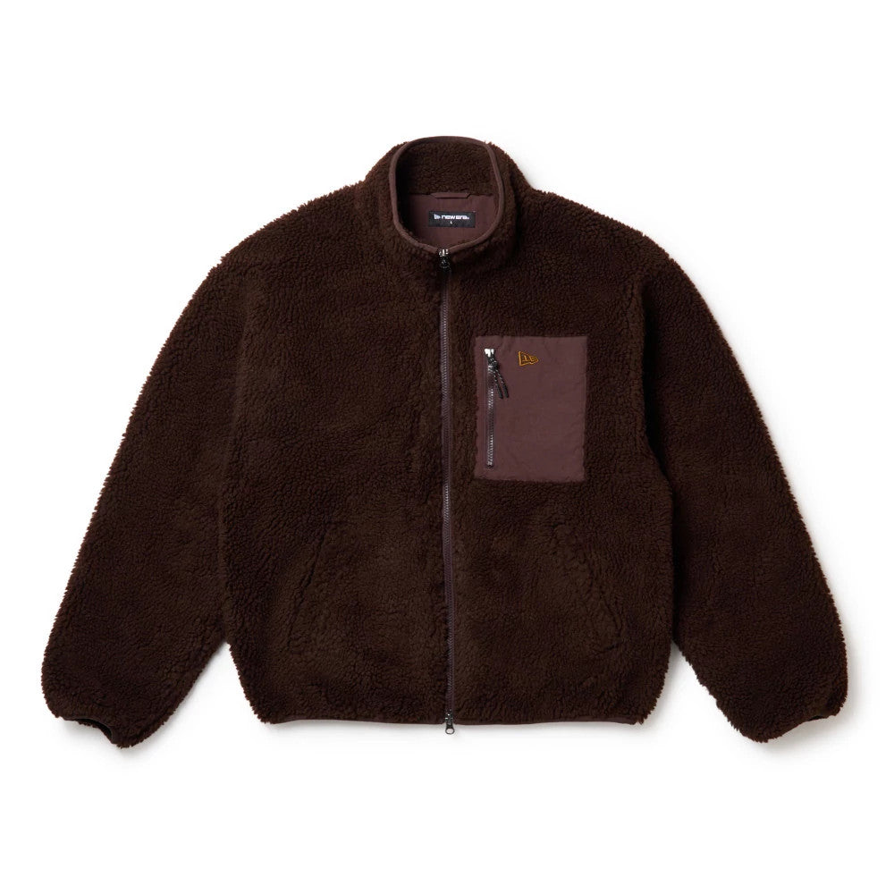 New Era Blouson Dark Brown Jacket, front view showing the textured dark brown surface with a front zip closure, a contrasting patch pocket on the left chest featuring an embossed New Era logo, and a high collar design.