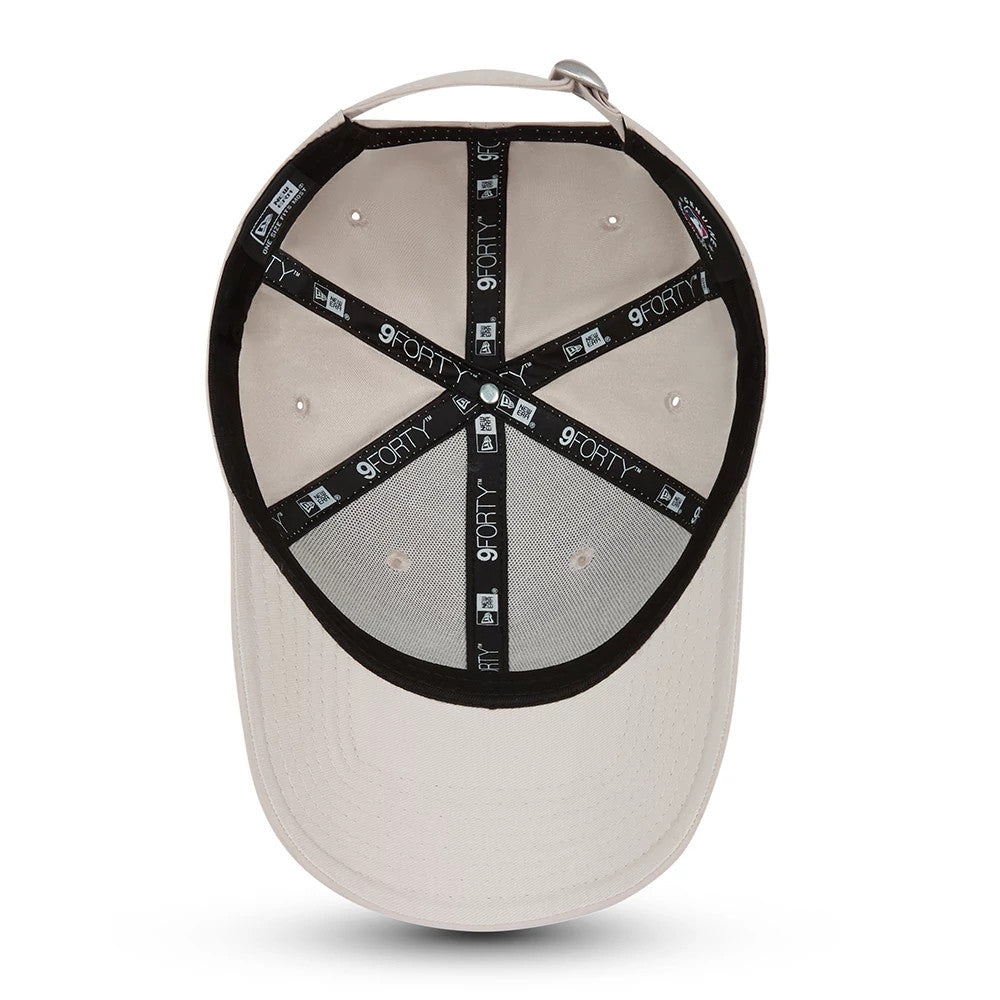 New York Yankees Tonal Stone New Era 9FORTY Cap, inside view showing black branded taping across the tan crown interior, white sewn eyelets, and no inside sticker on the grey undervisor.